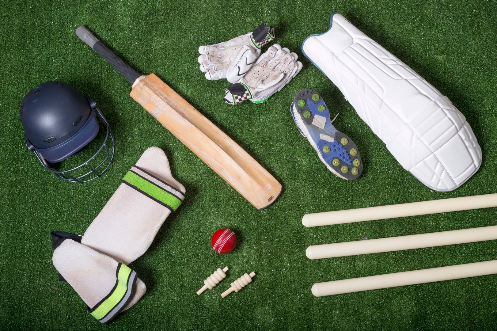 Cricket equipment on the grass from above