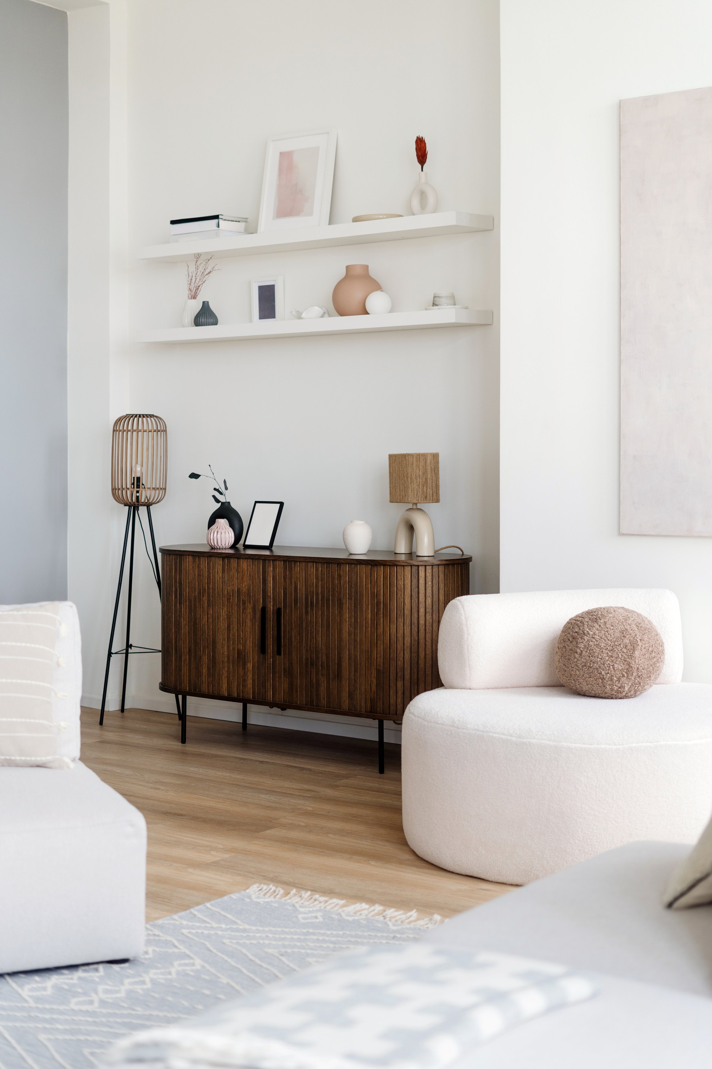 A cozy living room with minimalist decor and warm lighting