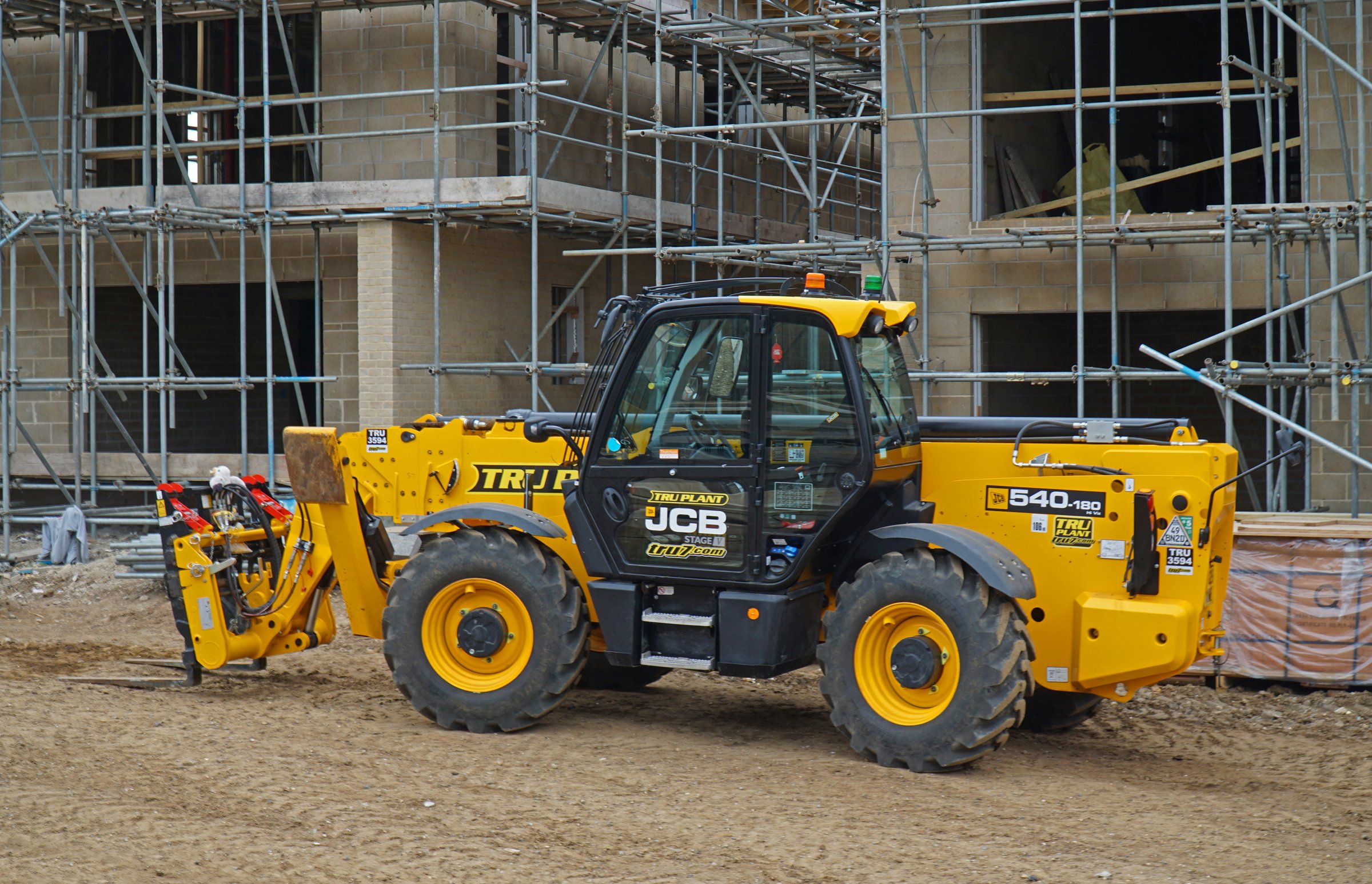 Felixstowe, Suffolk, England - October 16, 2025:  JCB 540-180 HiViz Loadall, telescopic handler on building site