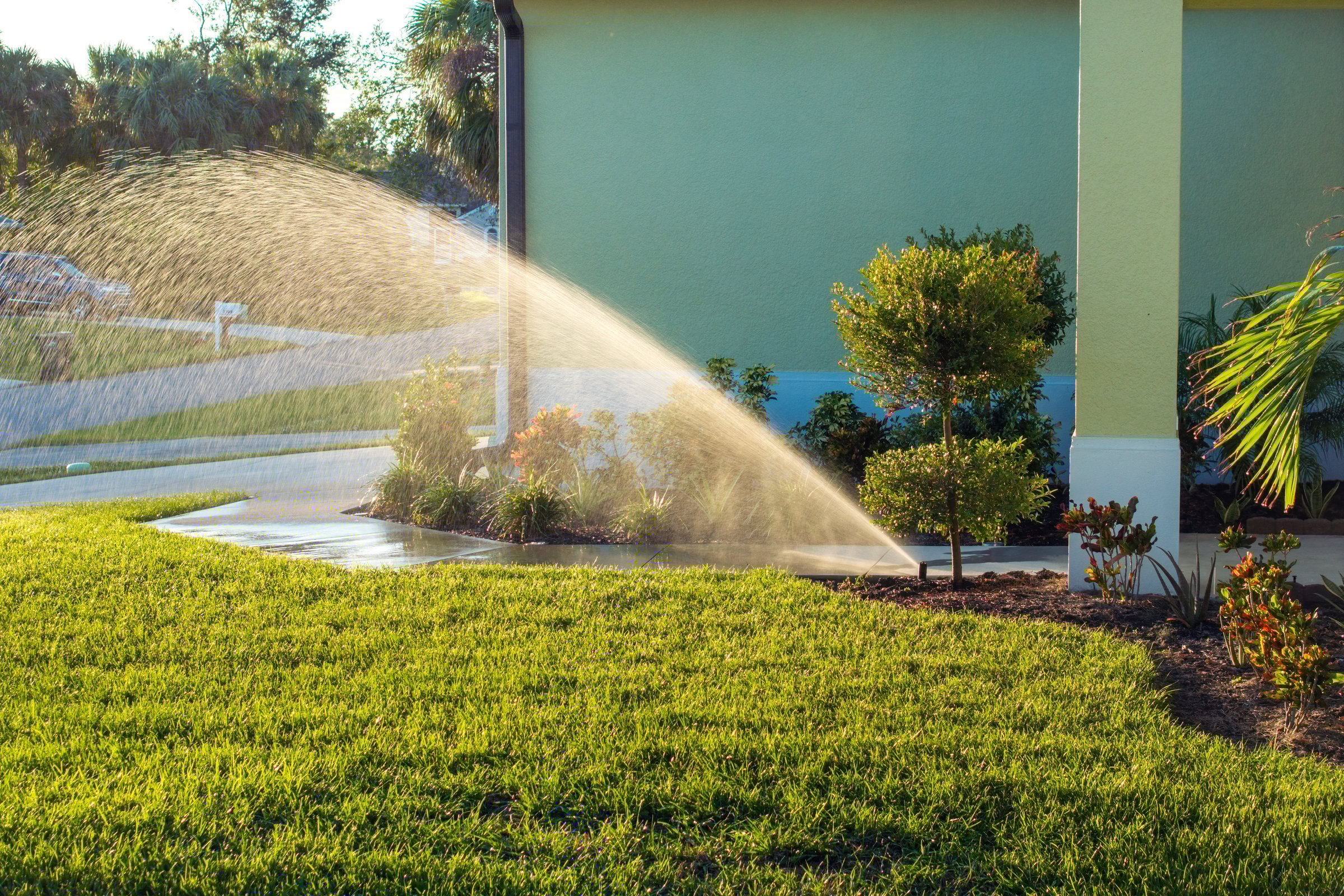 Automated sprinkler watering green lawn