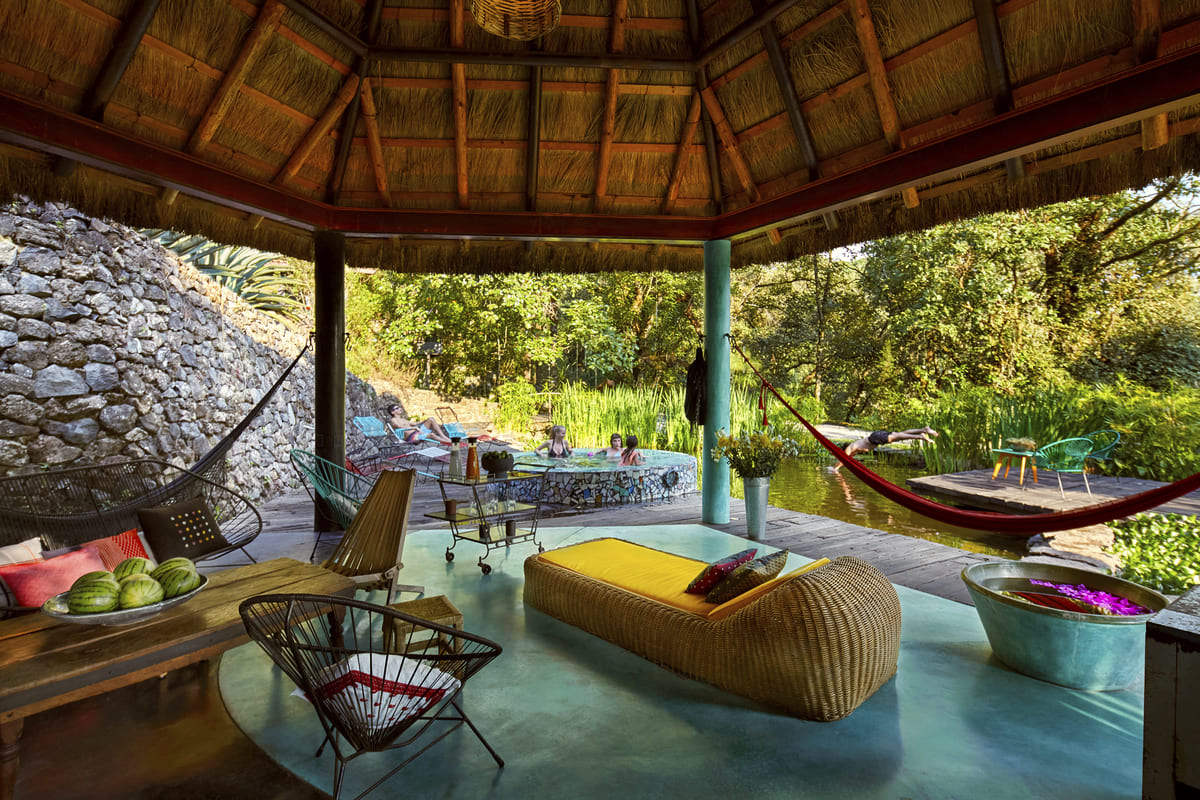 Outdoor bathroom with stone wall