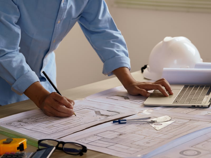 Architectural and engineering concept. Collaboration and strategy for construction. Building, planning and civil engineering team in workshop with paperwork for project management.