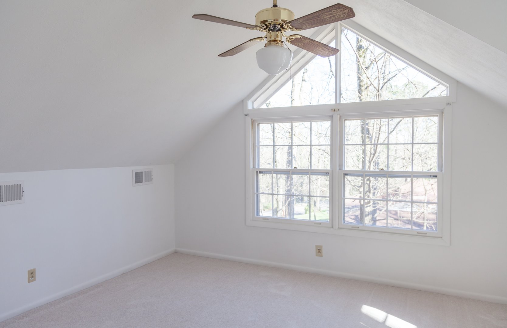 Freshly painted white empty loft bedroom