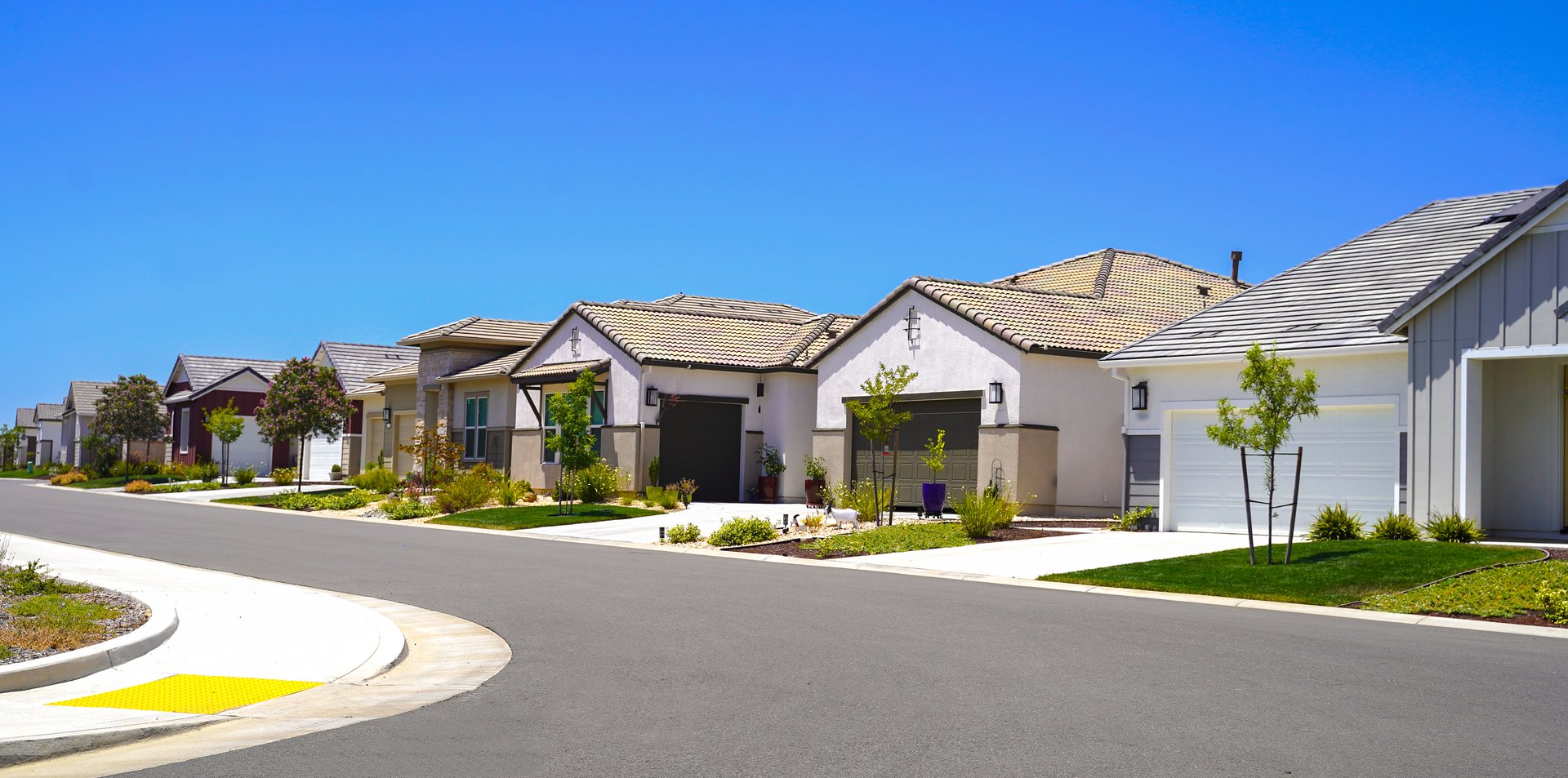 Single family homes in a row on an empty road in Northern California