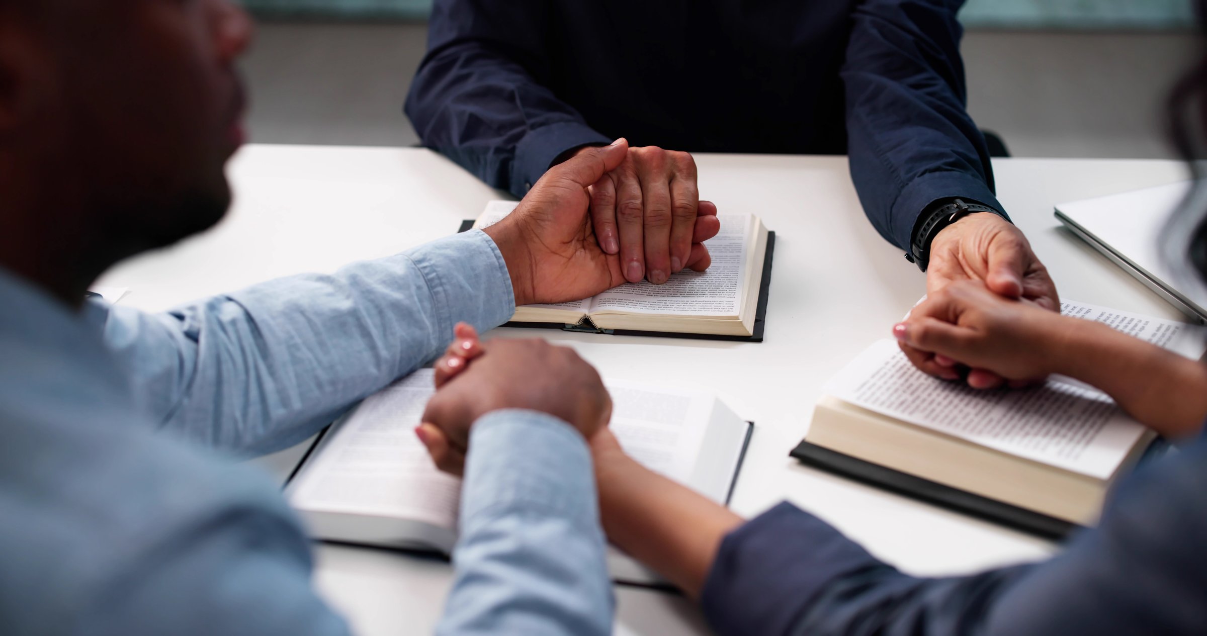 Multiracial Community Studies Bible Together, Praying For Unity And Peace