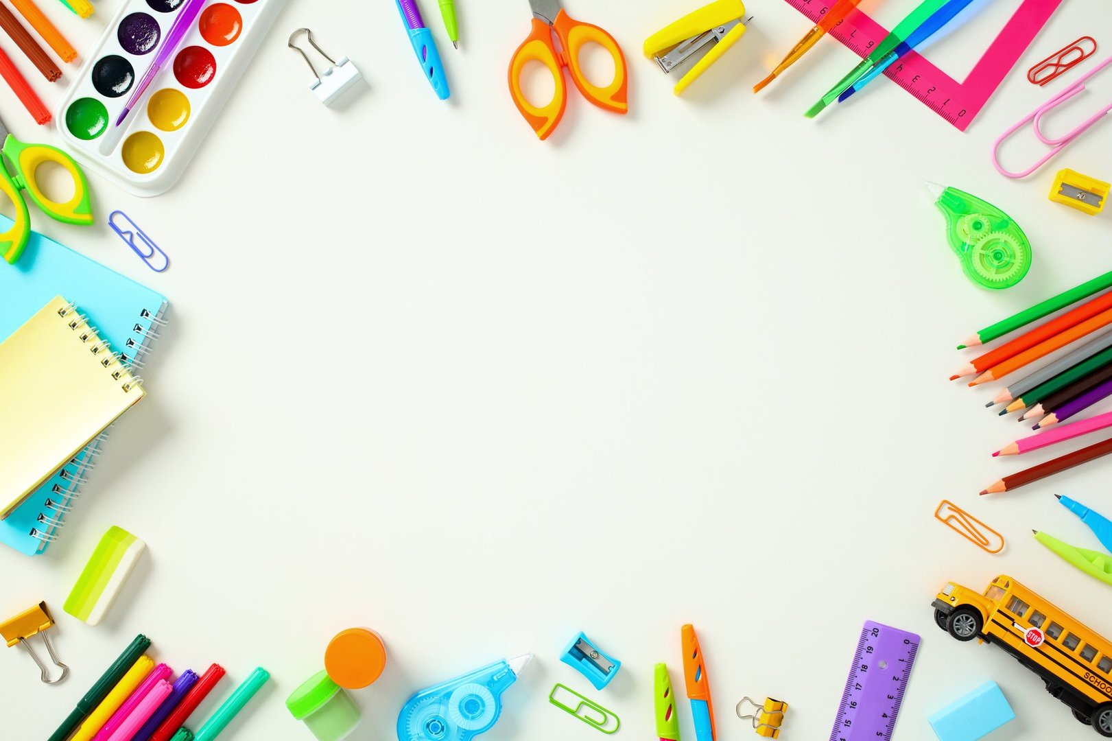 Back to school concept. Flat lay frame of colorful school supplies on white background. Copy space.