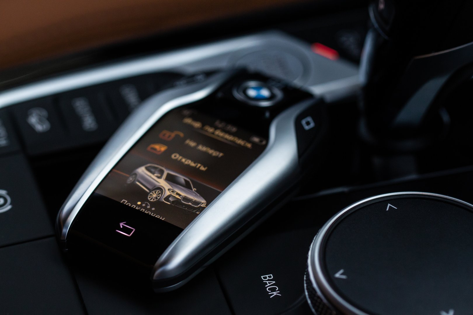 MOSCOW, RUSSIA - FEBRUARY 05, 2022. BMW smart key close up view. Modern BMW wireless car key. Translation: Opened. Connected.