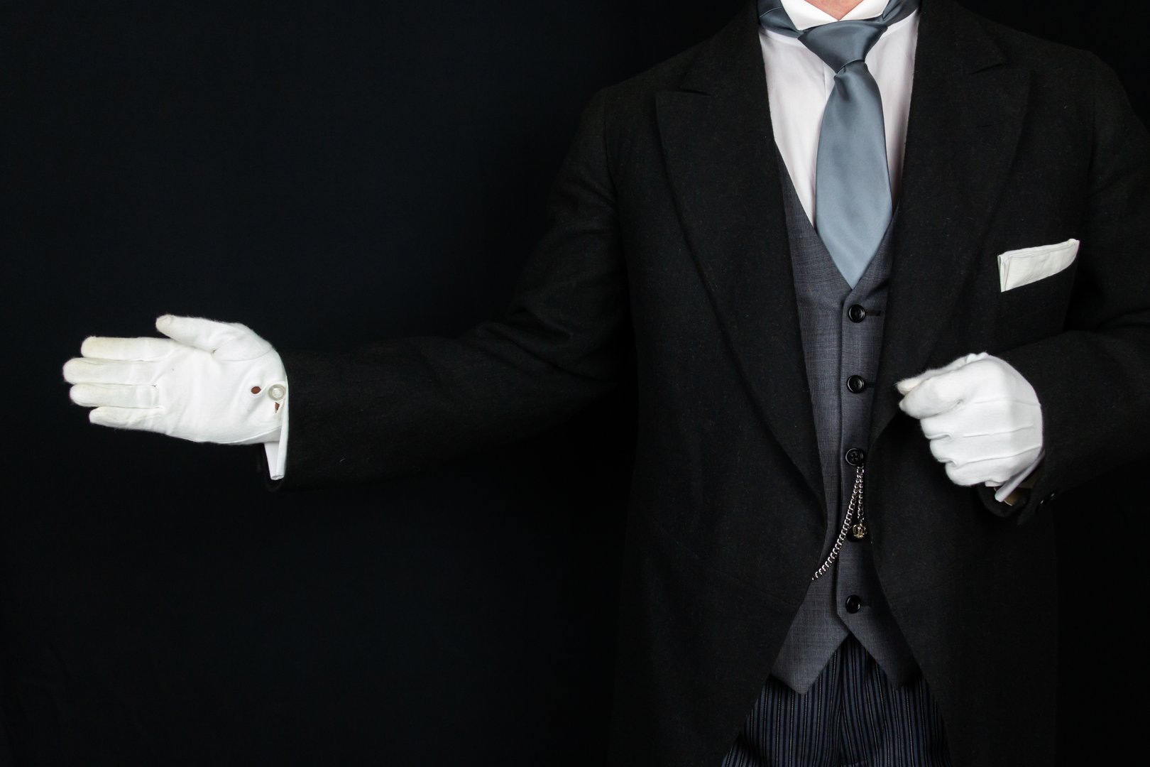 Butler in White Gloves With Welcoming Gesture