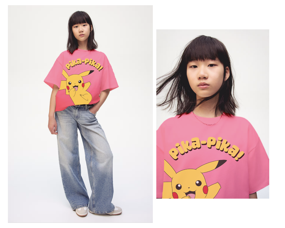 Person wearing a pink Pikachu t-shirt and jeans, standing with a relaxed pose, hair blowing slightly.