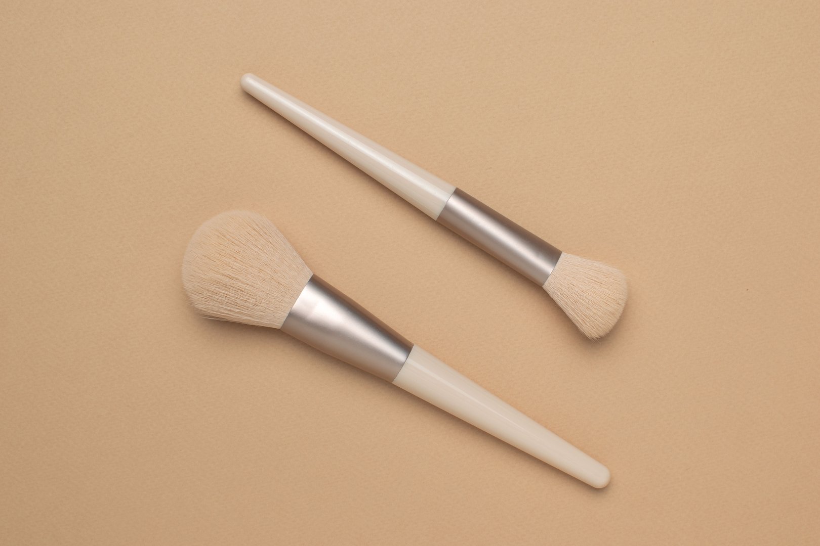 Minimalist Makeup Brushes on Beige Background