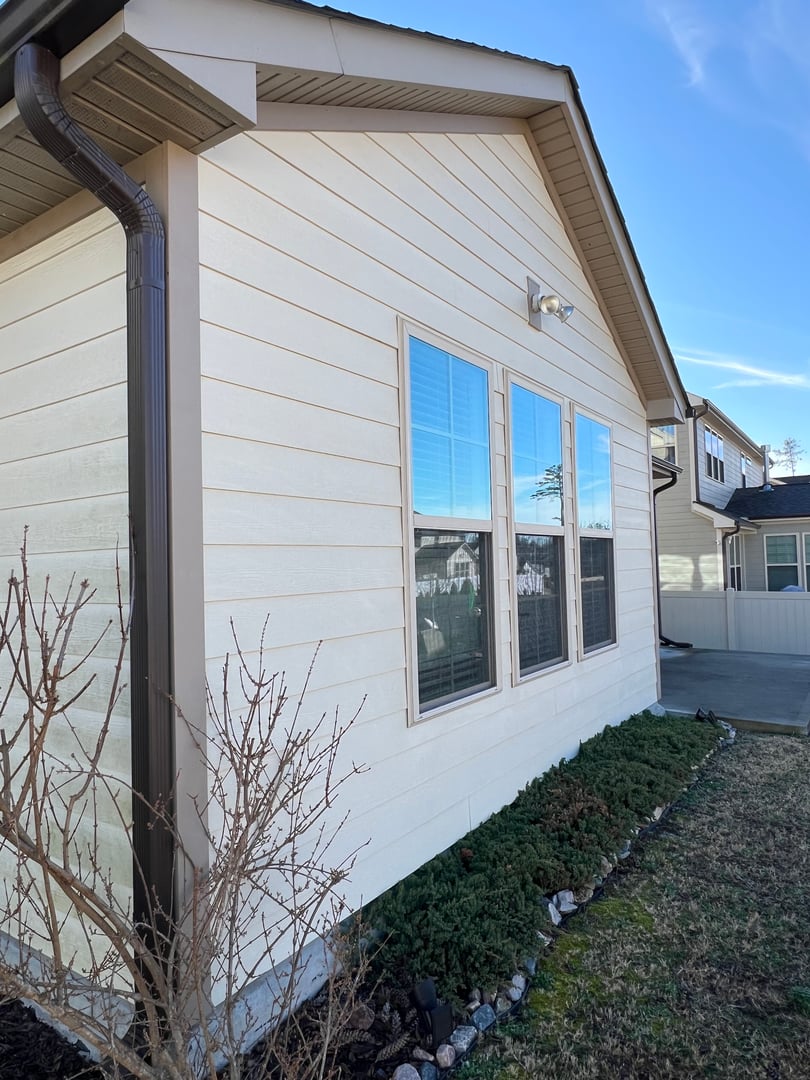 Washing house with a high-pressure nozzle spraying water and soap cleaner in order to take care the cleaning and maintenance of house