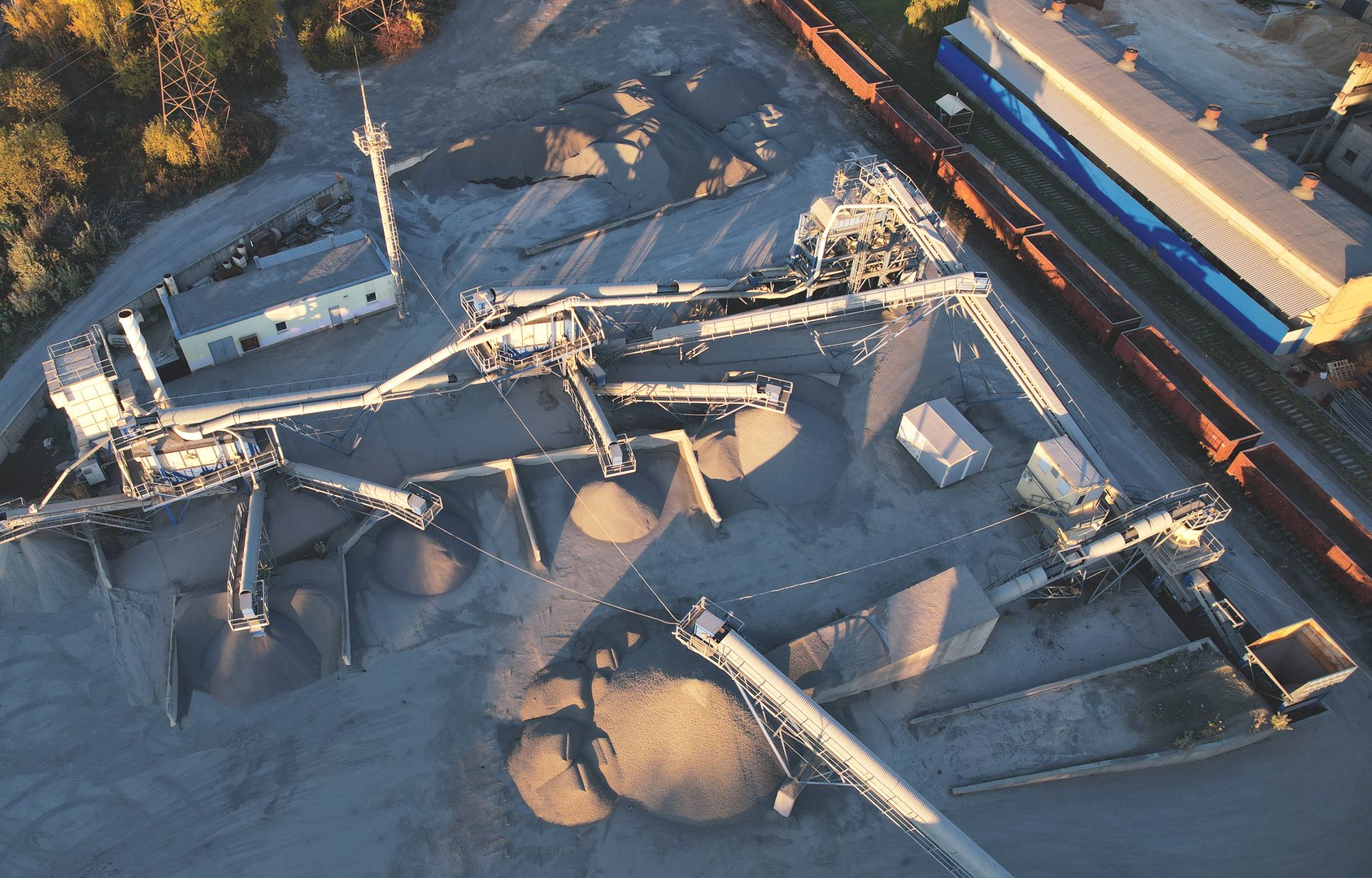 Cement plant and ready mix concrete. Plant for the production of cement and dry mortar for the construction industry. Crushing the stones for the cement production, Aerial View. Industrial solutions.