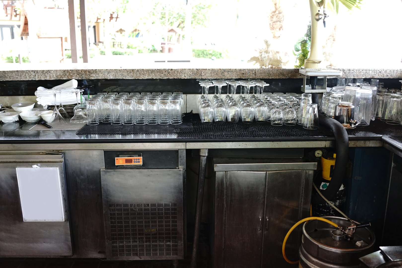 Beer bar counter with empty glass arrangement on counter