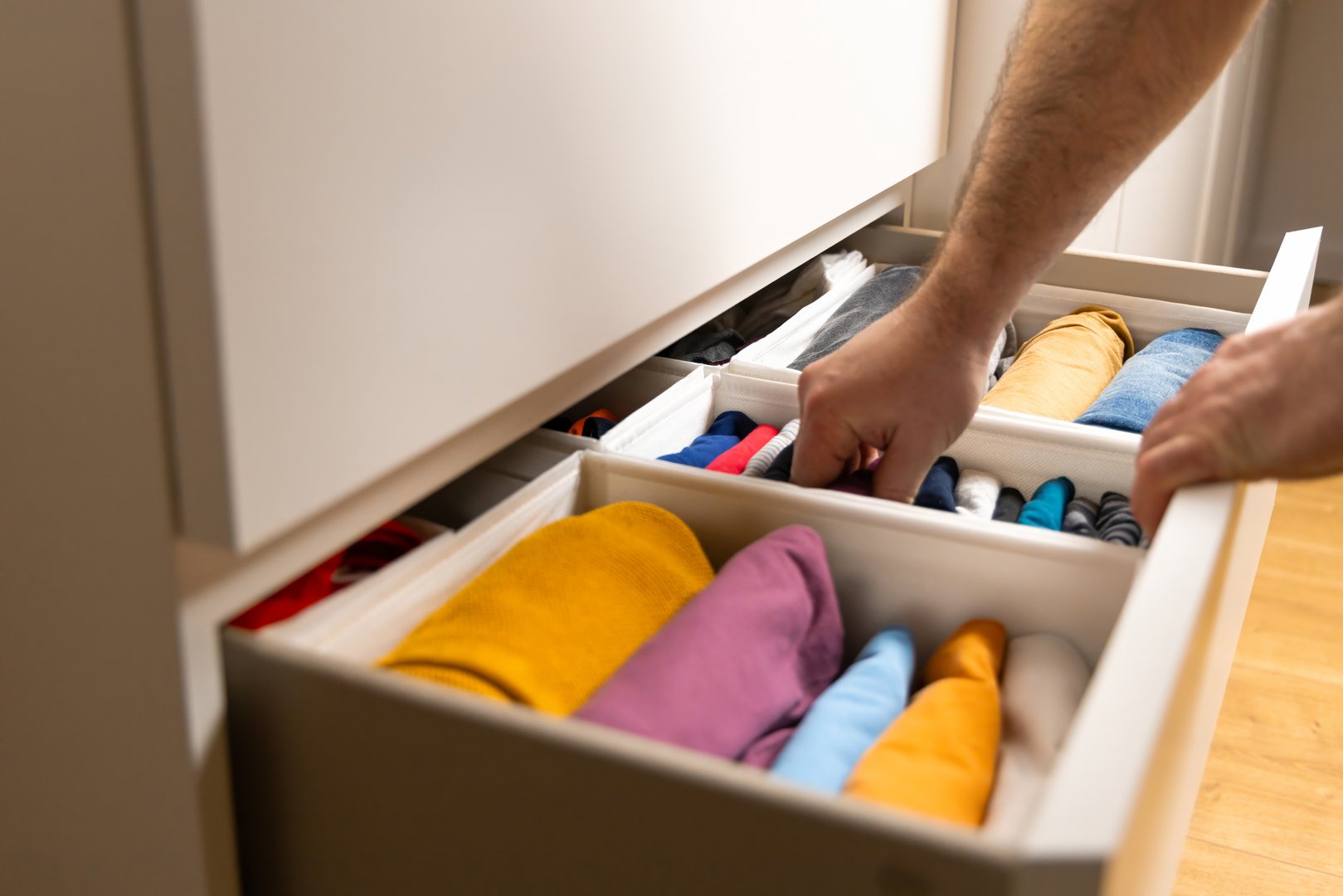 KonMari Method. The photo illustrates a popular method of storing clothes, where items are placed vertically for convenience.