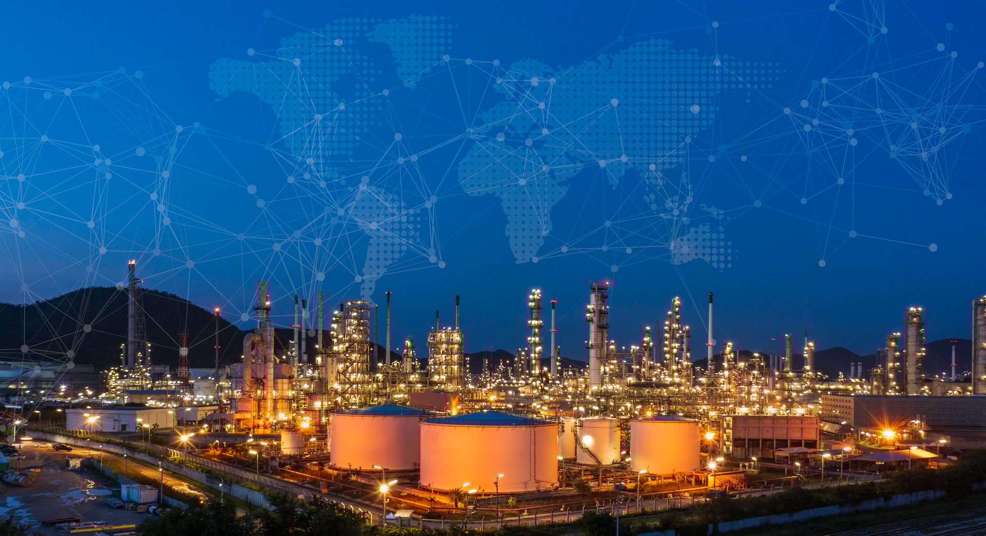 Oil refinery at twilight and night with industrial physical system icon diagram Supports the concept of Industry 4.0 technology.
