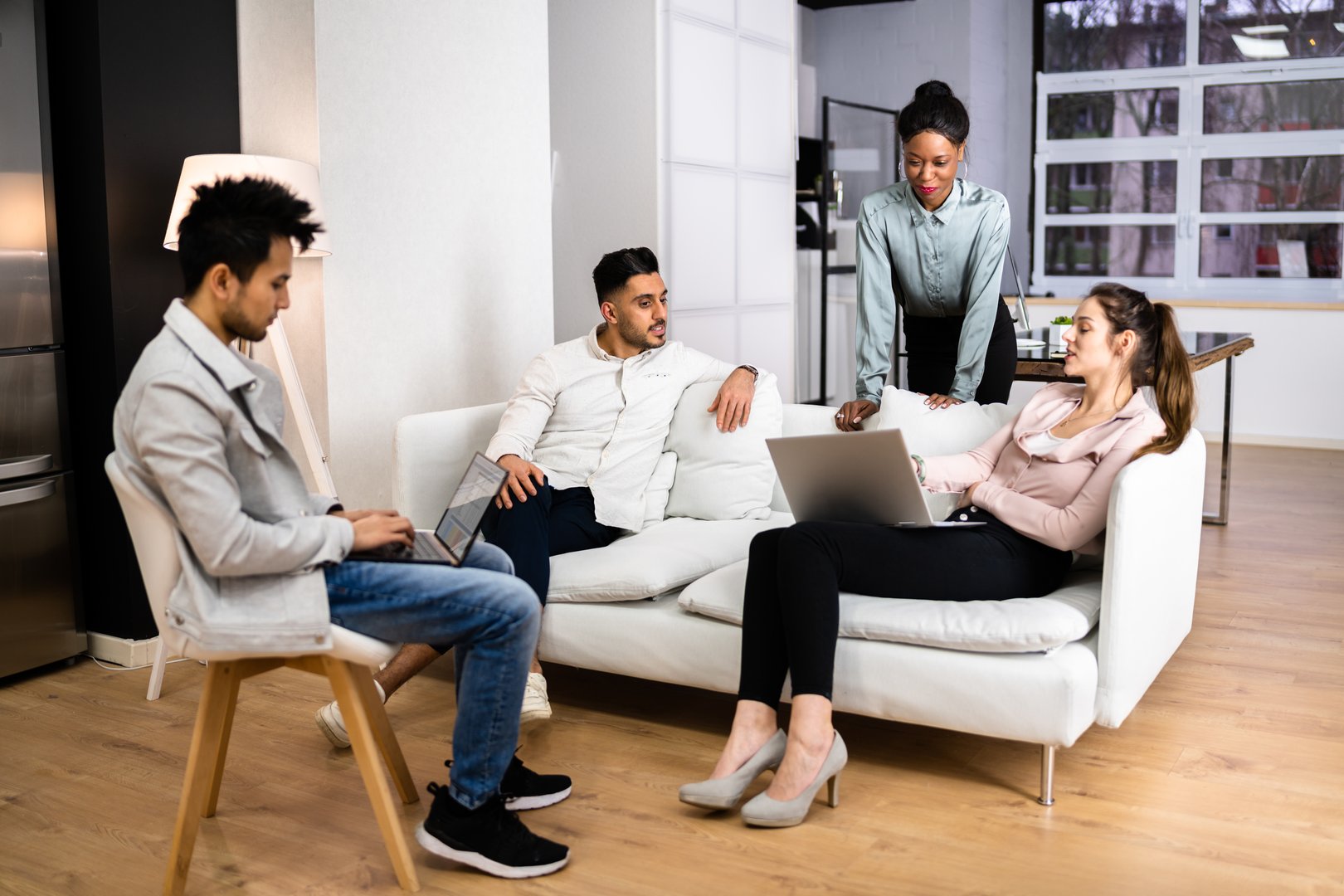 Young Diverse People Using Laptops In Coworking Space