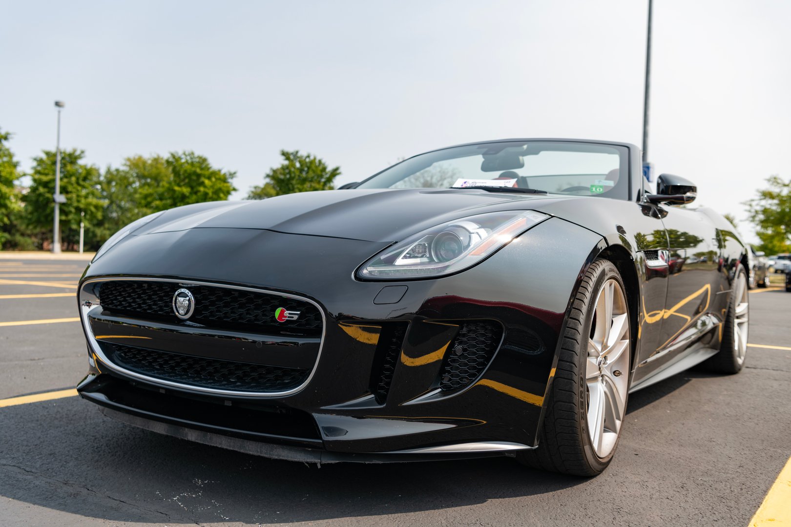 Chicago, Illinois, USA - September 08, 2024: Jaguar F-TYPE S v8 AWD Convertible vehicle, front view. Modern Jaguar F-TYPE S v8 AWD Convertible car black color. F-TYPE R75 AWD Convertible car. F-TYPE S v8 AWD Convertible at Chicago
