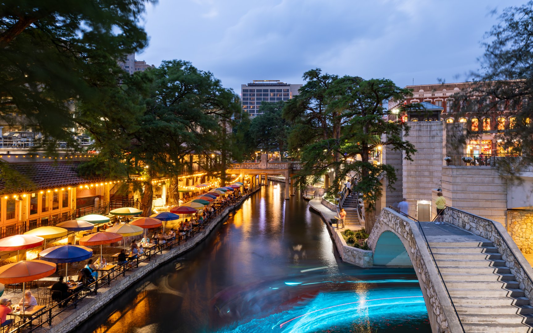 Long exposure light trails from boats along the Riverwalk in San Antonio, Texas USA