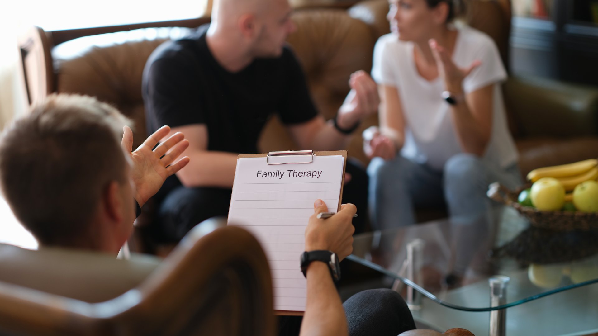 A married couple speaks with a psychologist, a close-up. Family therapy, consultation