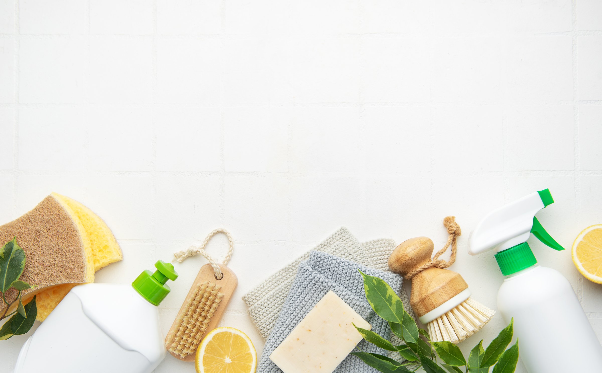 Natural cleaning products and tools promoting a zero waste lifestyle with copy space