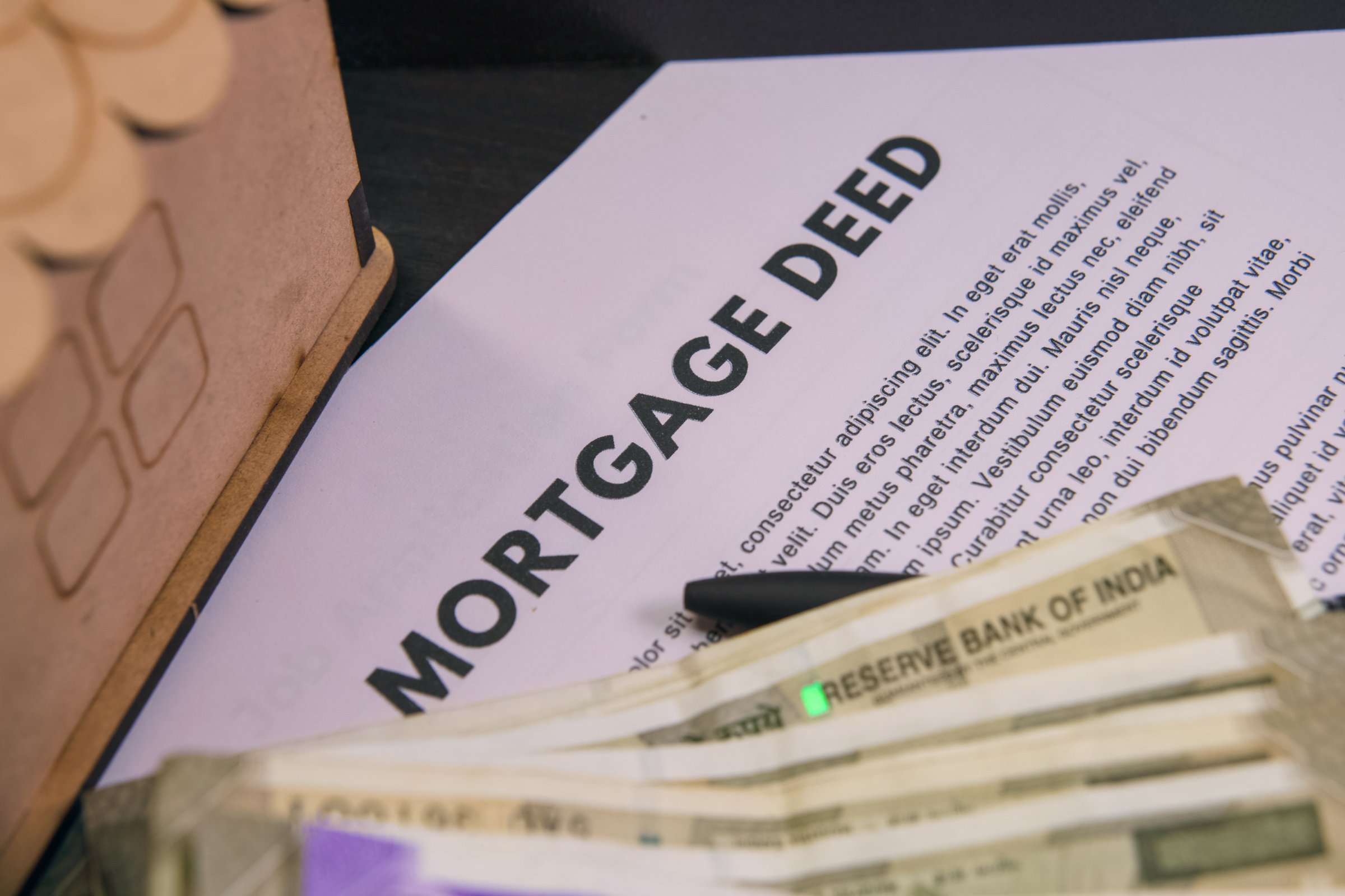 Mortgage deed document with cash and financial notes