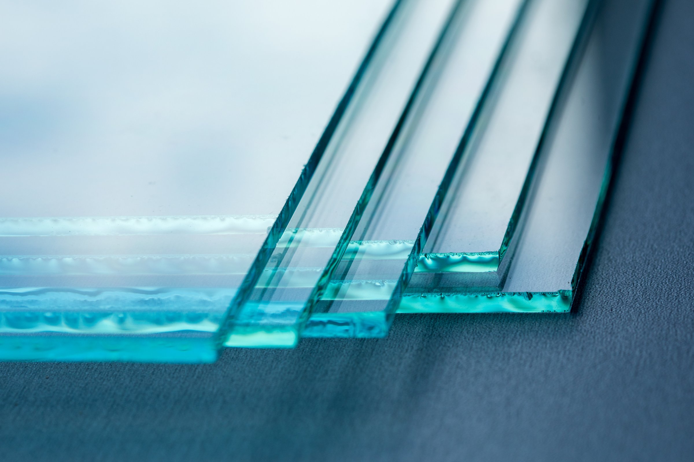 Sheets of Factory manufacturing tempered clear float glass panels cut to size.