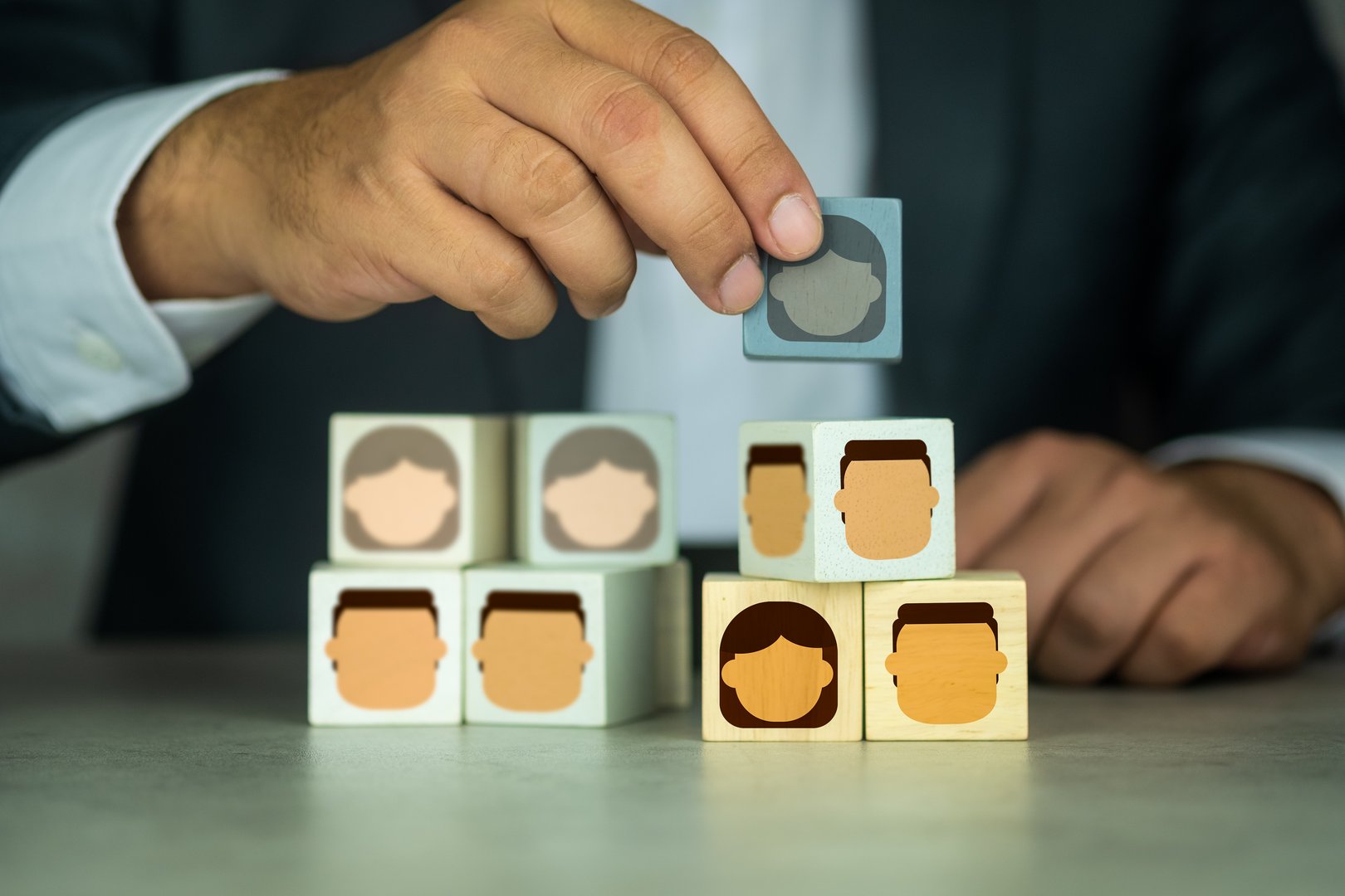 Man chooses an employee for building the team, assemble a business team, team building, targeting, personalization and HR management concepts.