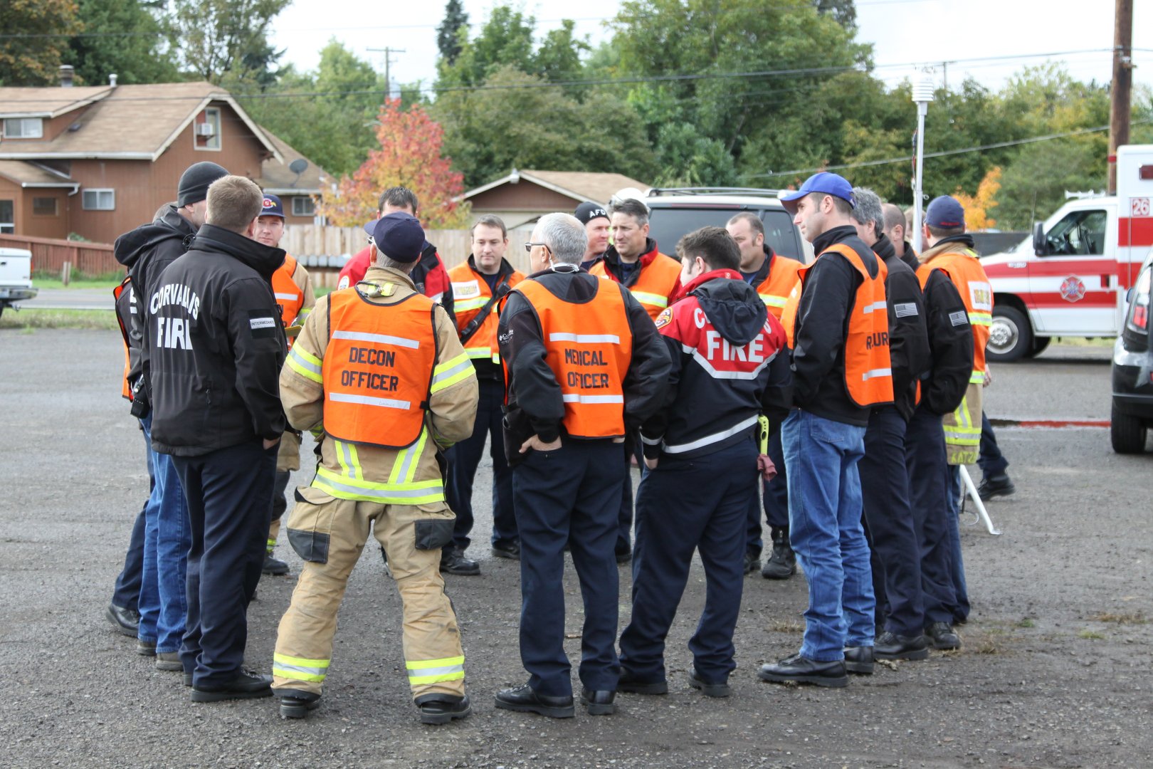 Emergency response team members gathers around to discuss options during disaster drill
