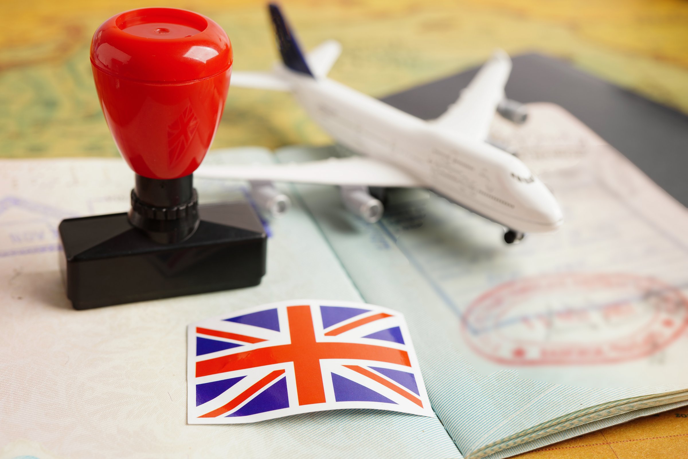 Visa and passport document with atamp and United Kingdom flag  to immigration at airport in country.