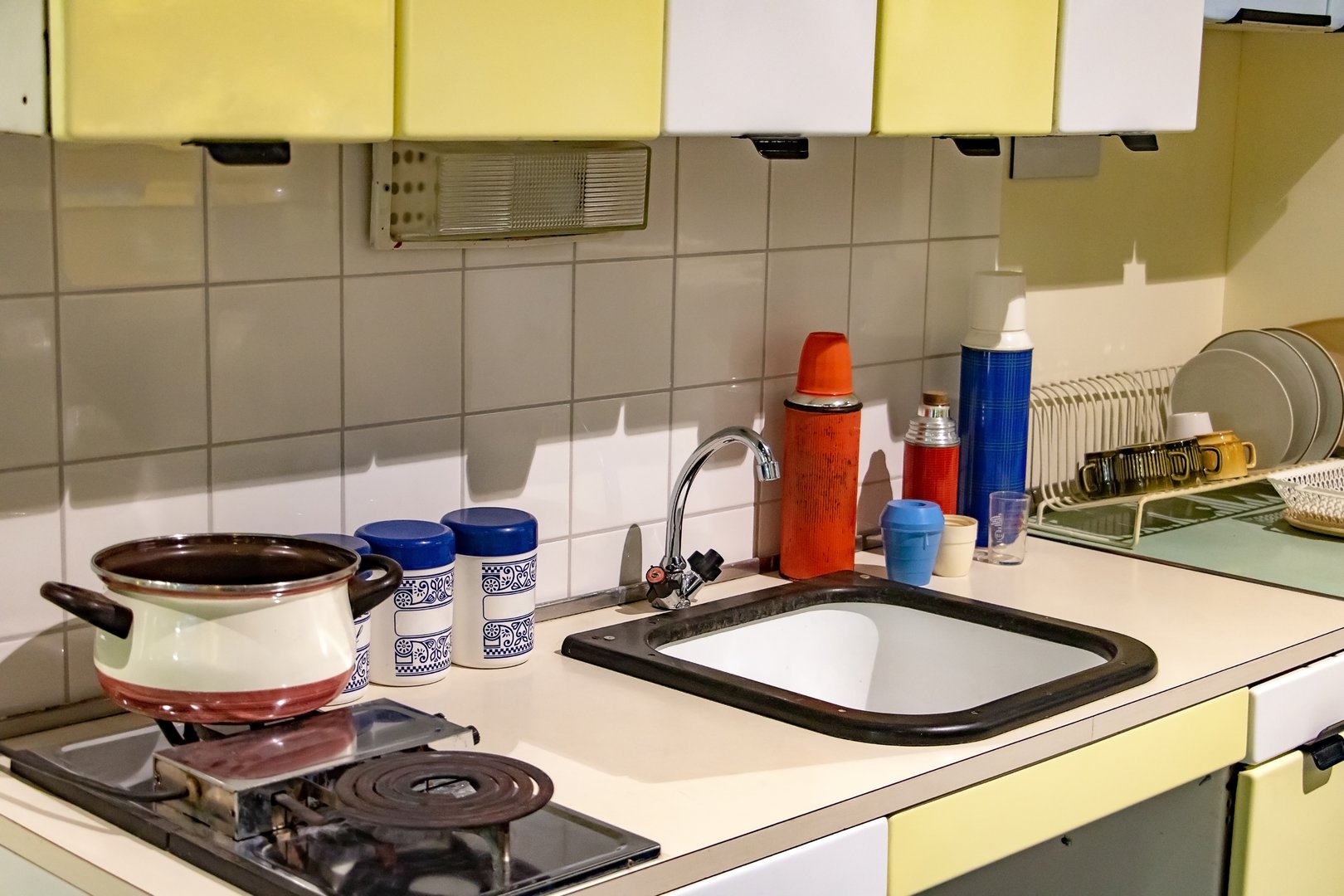 1970s outdated kitchen with avocado green appliances