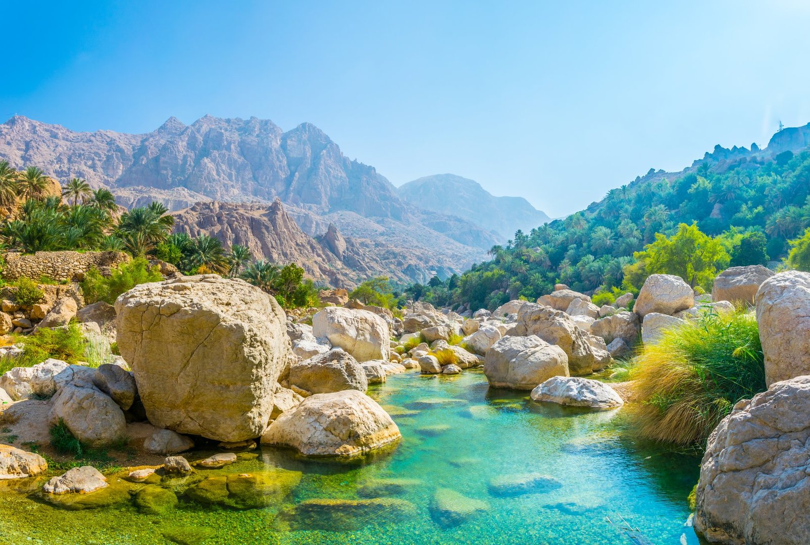 Lagoon with turqoise water in Wadi Tiwi in Oman.