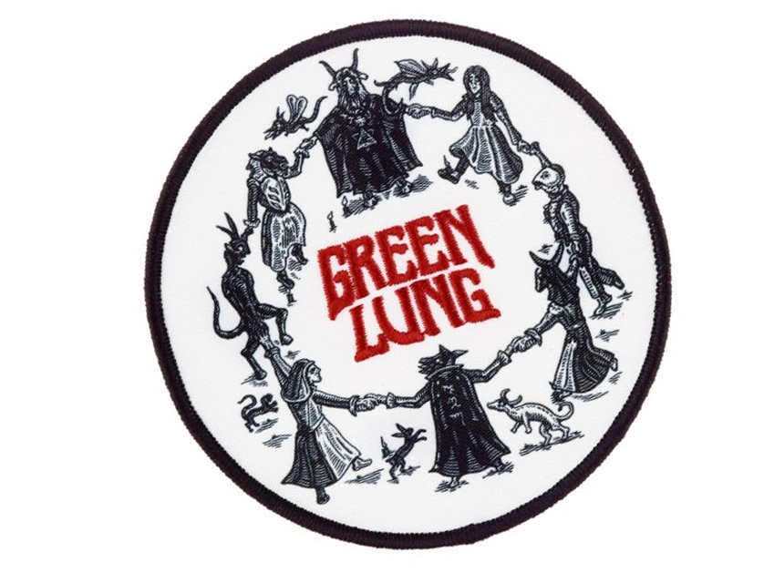 Circular patch depicting figures in a hand-holding circle around the words Green Lung, featuring mystical and occult elements.