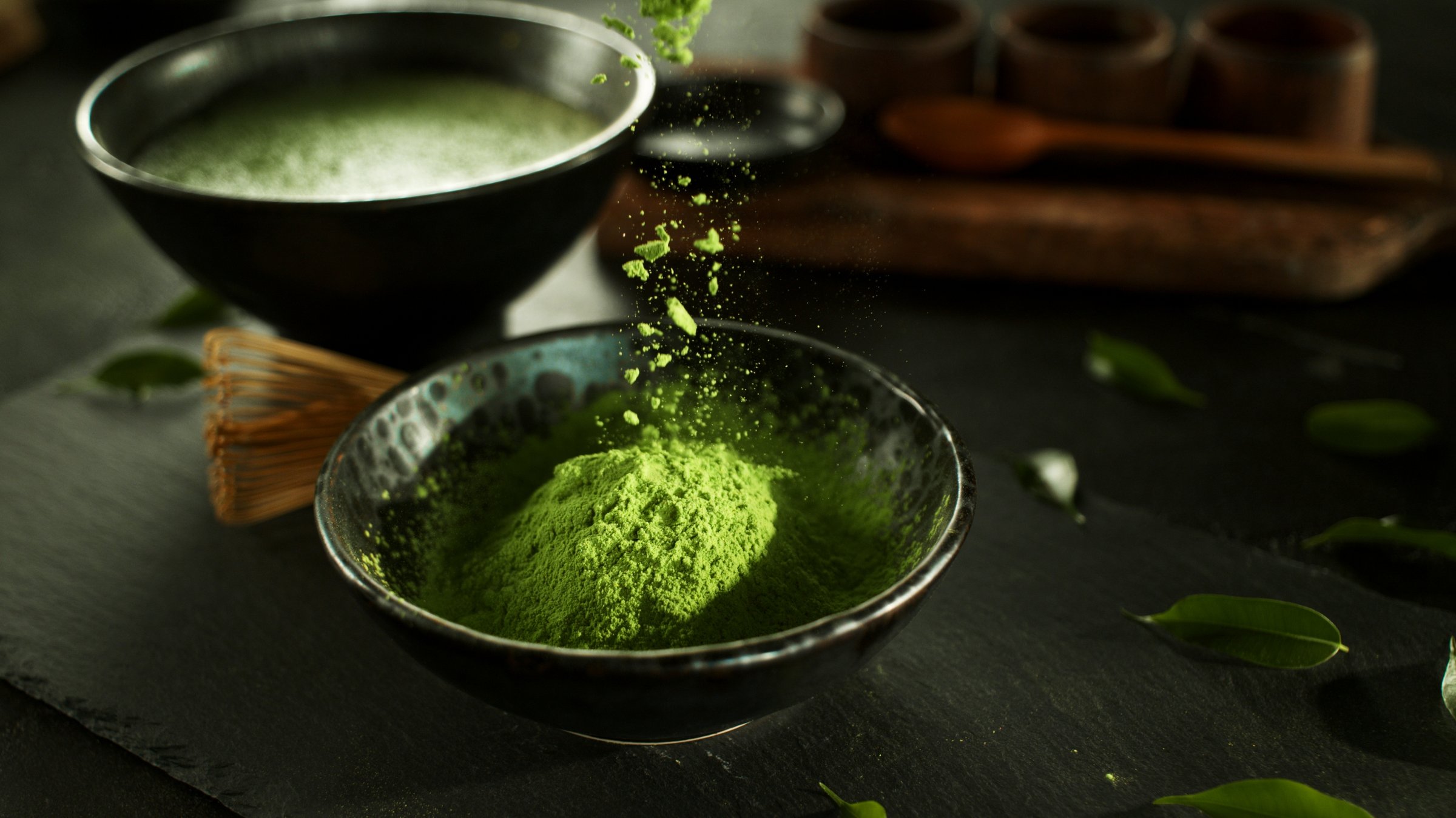 Freeze Motion Detail Shot of Sprinkling Matcha Powder
