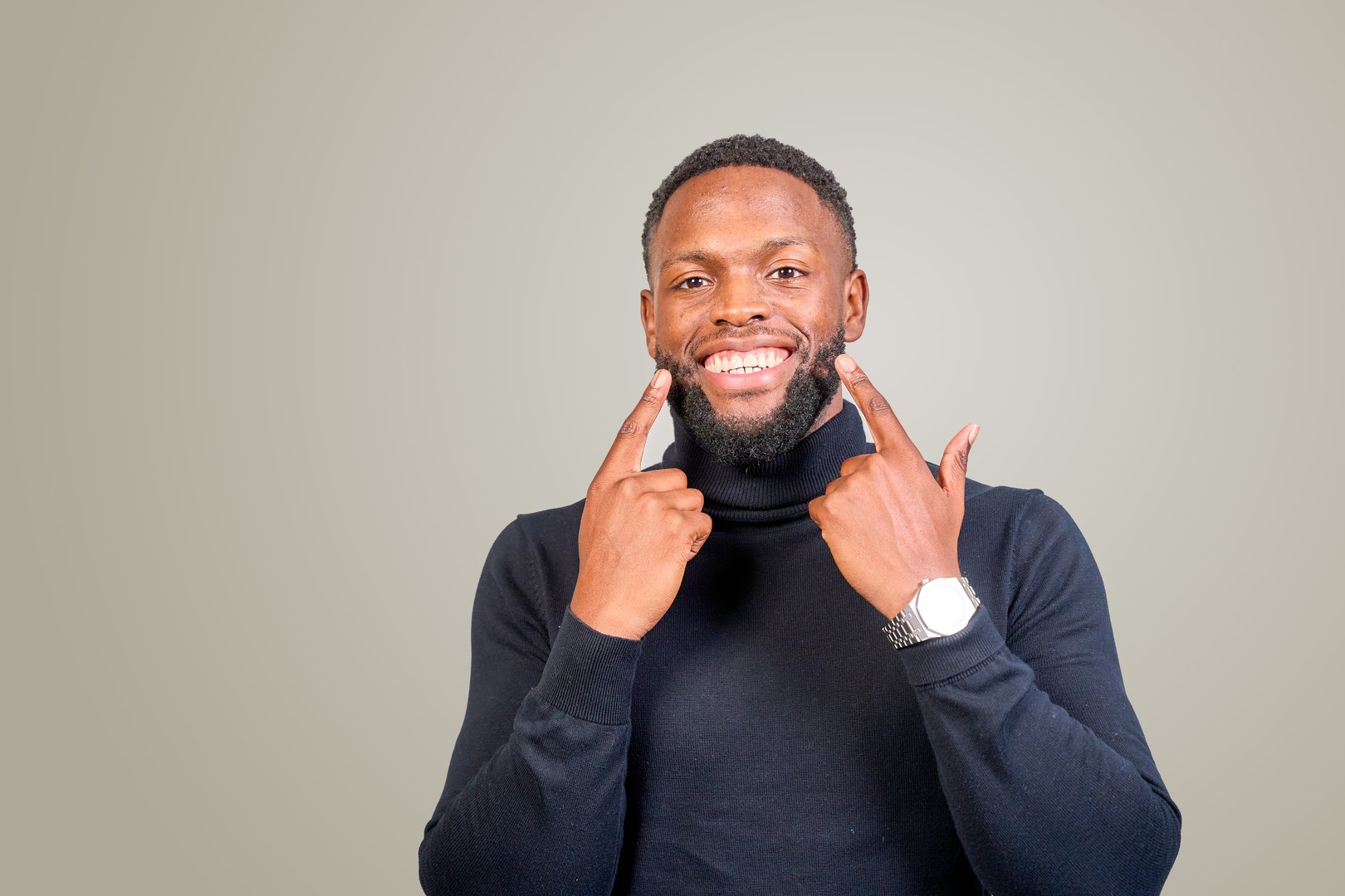 Black businessman with perfect white smile after whitening treatment