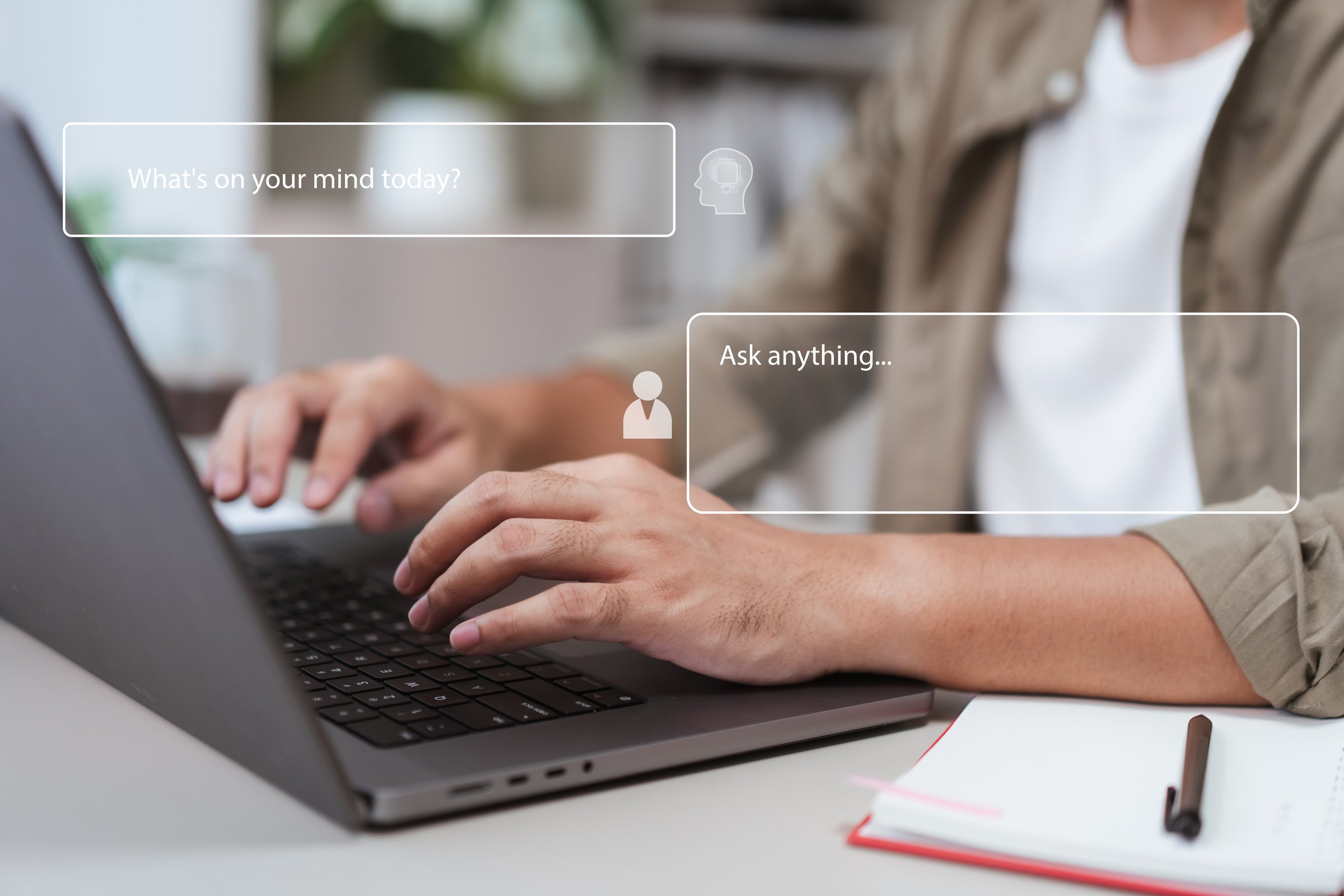Close-up of hands typing on laptop keyboard with chat message overlay interface. Concept of online communication, AI chatbot, digital customer service, and modern remote technology lifestyle