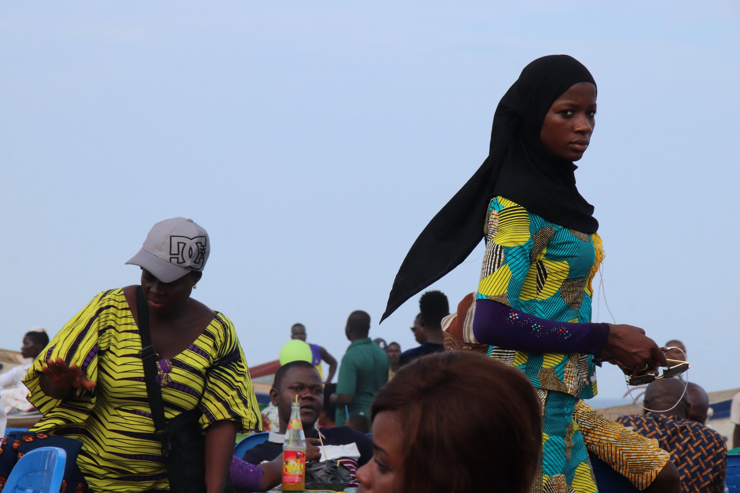 Lomé, Togo - June 23, 2019: Beautiful lady in a beach restaurant at the public beach of Lomé, the capital of Togo, West Africa.