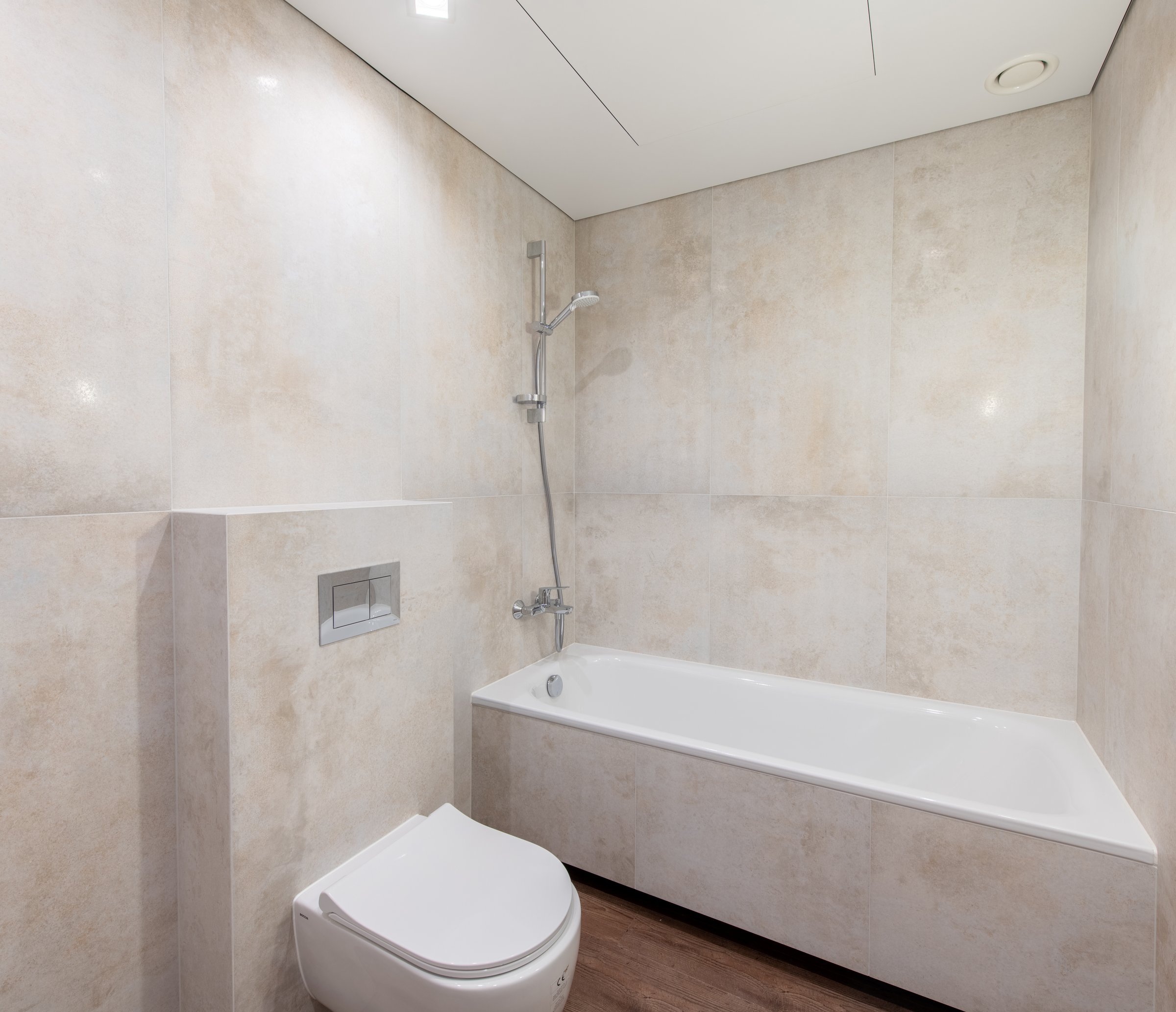 Bright Elegant Modern Bathroom Interior Design of Shower With White Sink. Marble Tiled Walls and Faucet. LED Lights. Under Construction. Wide Angle