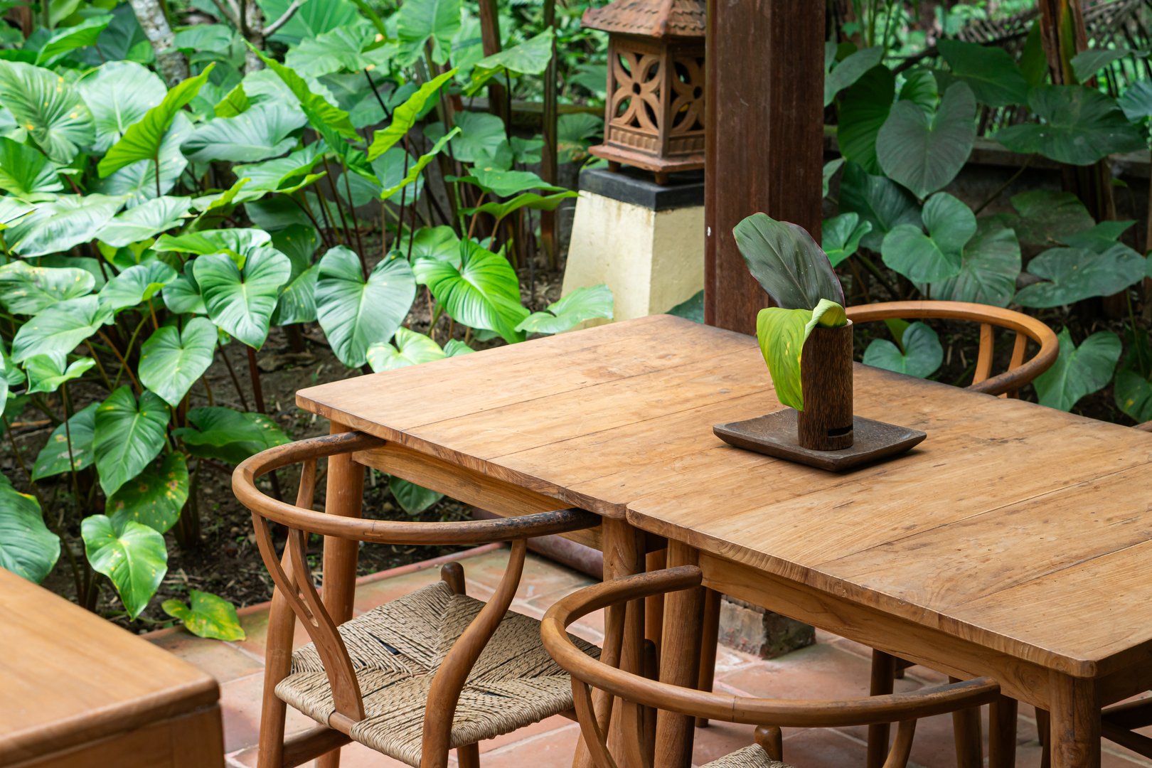 Outdoor dining area with wooden table and chairs