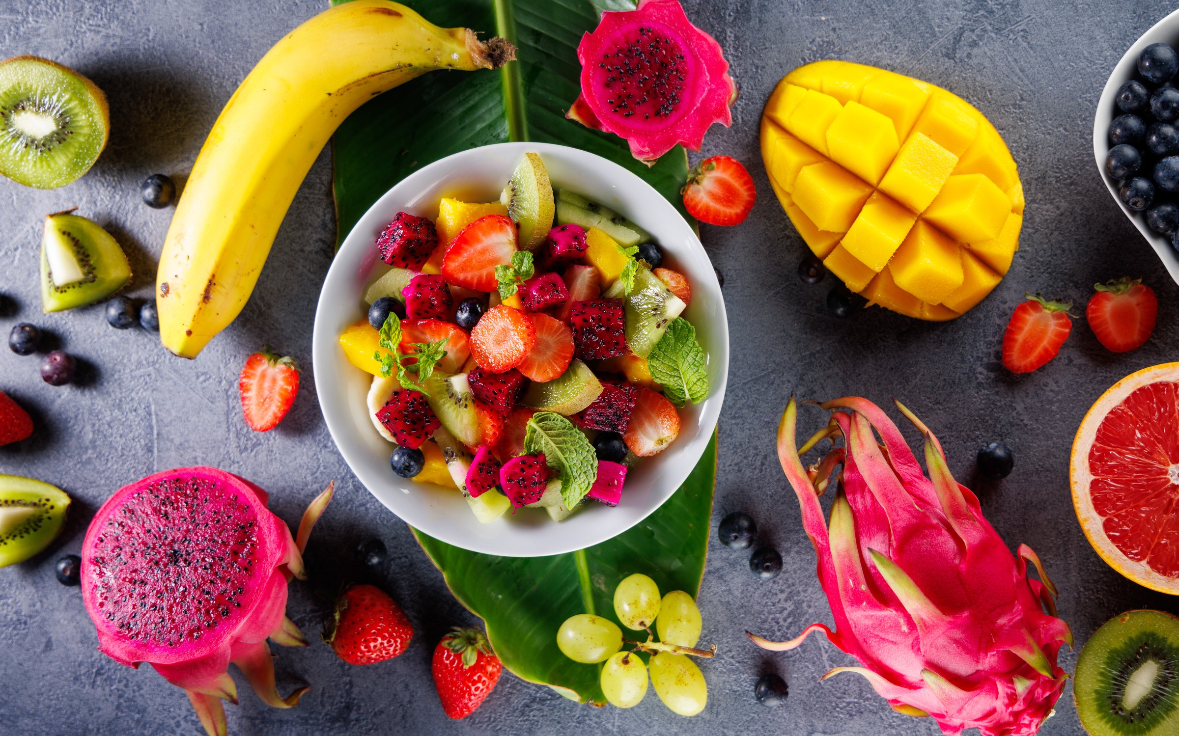 delicious juicy colorful fruit salad with exotic fruits