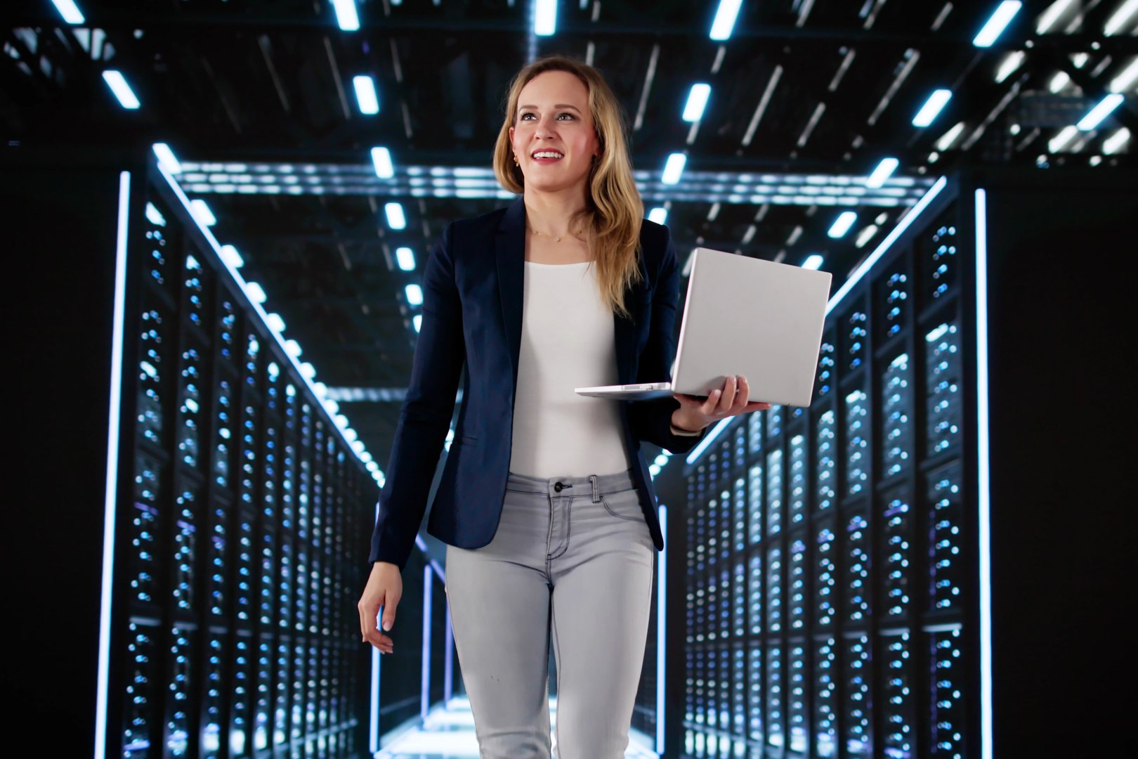 Smiling Female Engineer Installing AI Software In Data Center Server