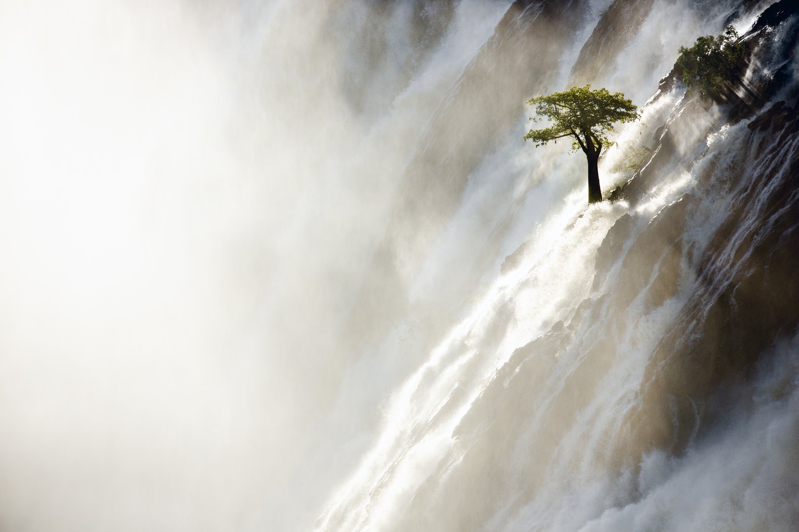 The Kunene River spills over the Ruacana Falls. Kunene Region, Namibia.