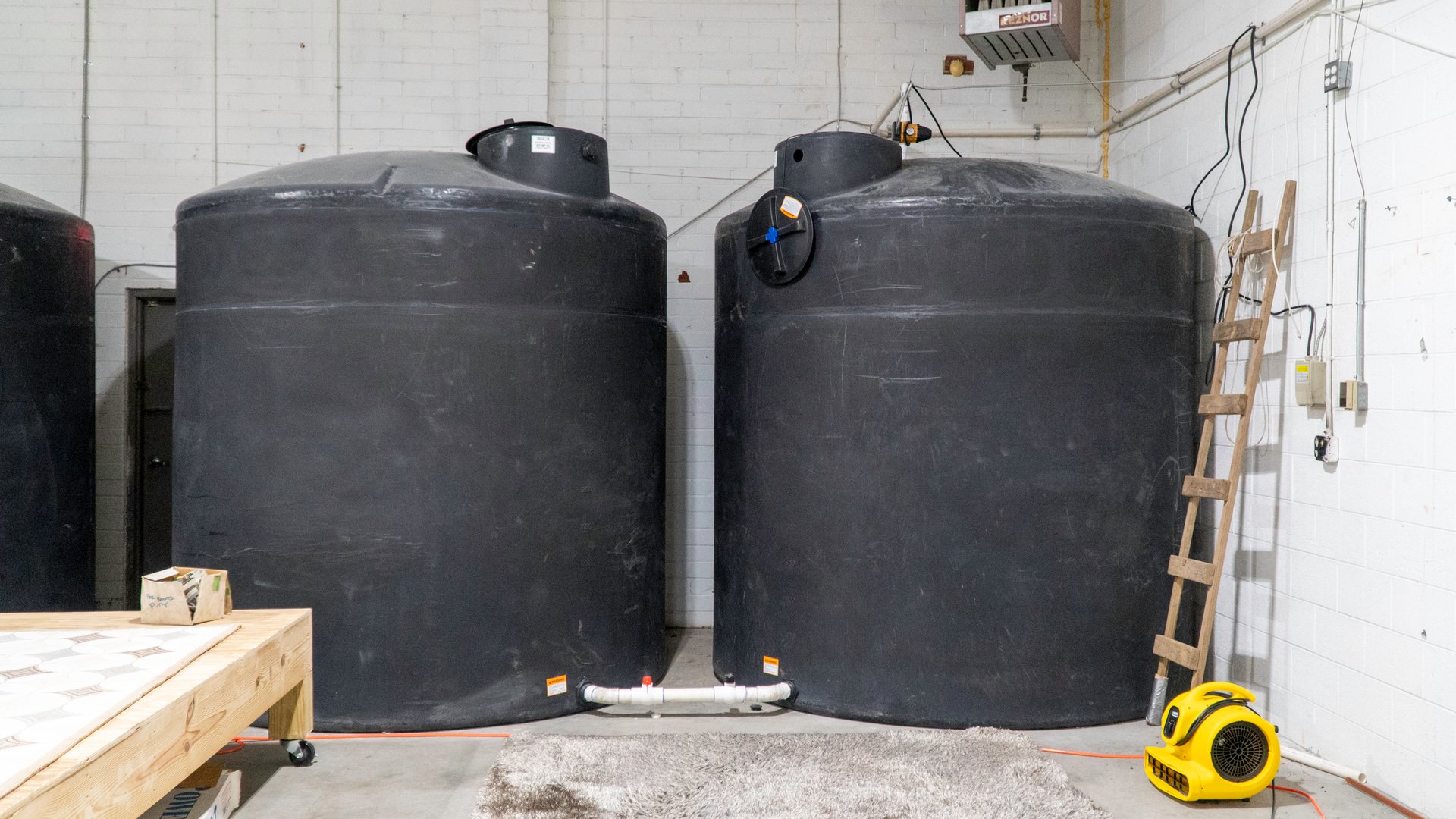 S&S Rug Cleaners rainwater collection tanks for eco-friendly sustainable rug cleaning in Atlanta