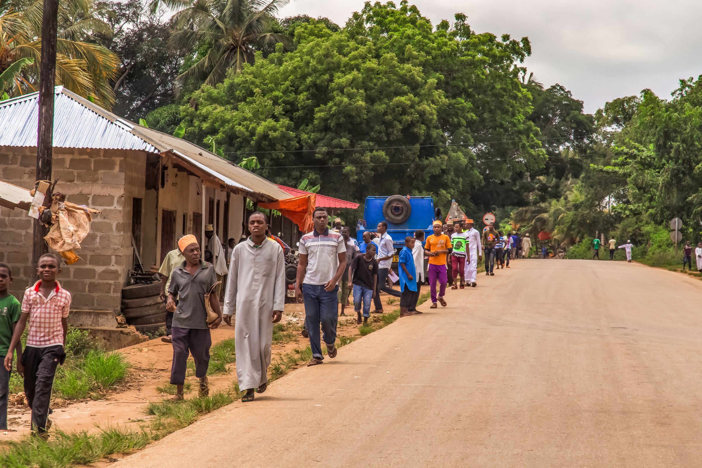 Zanzibar City, Tanzania. 30. 03. 2018. Street view of usual daily life of local people all ages taking place along road on Zanzibar Island in Tanzania.