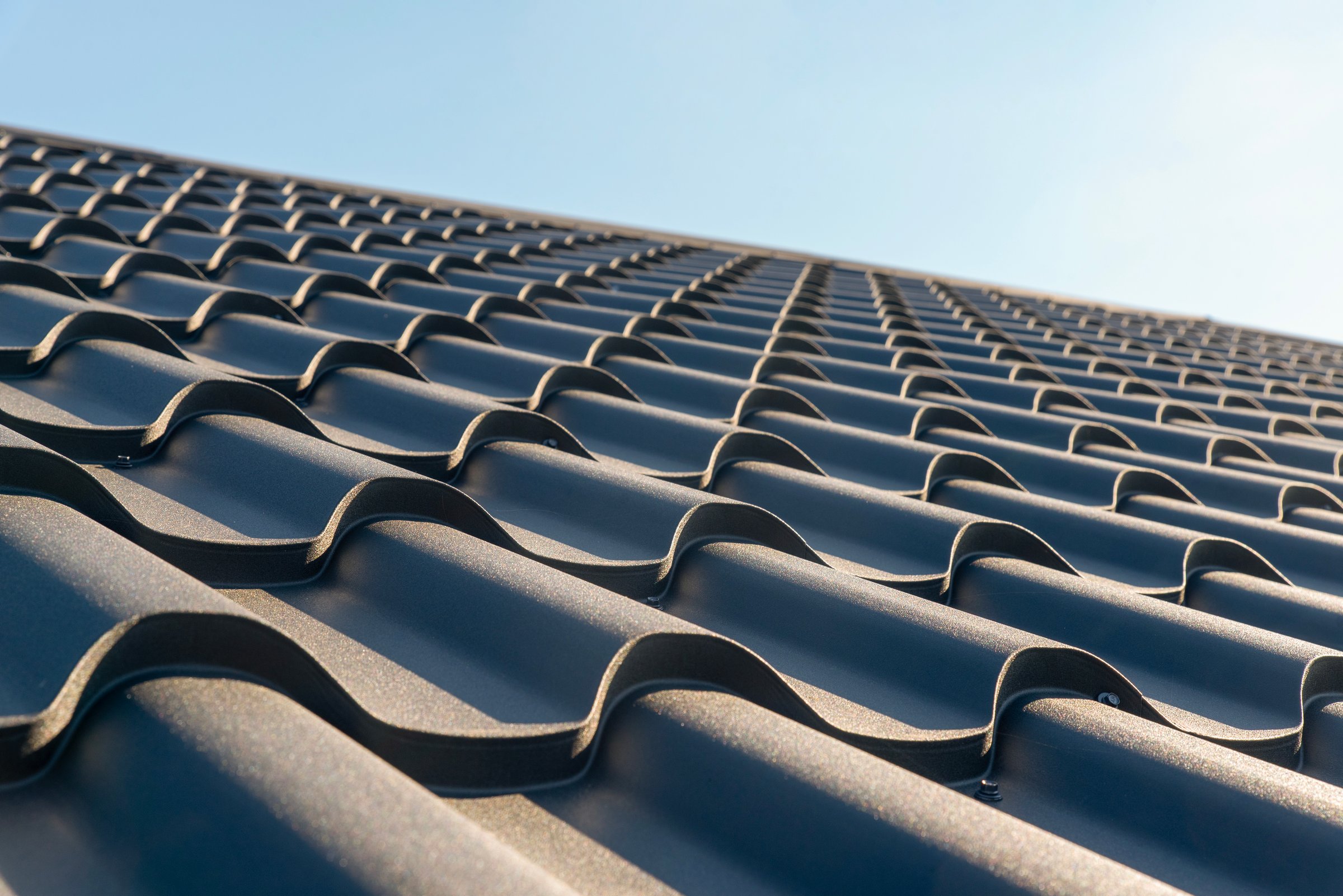 The roof of the house is covered with metal tiles
