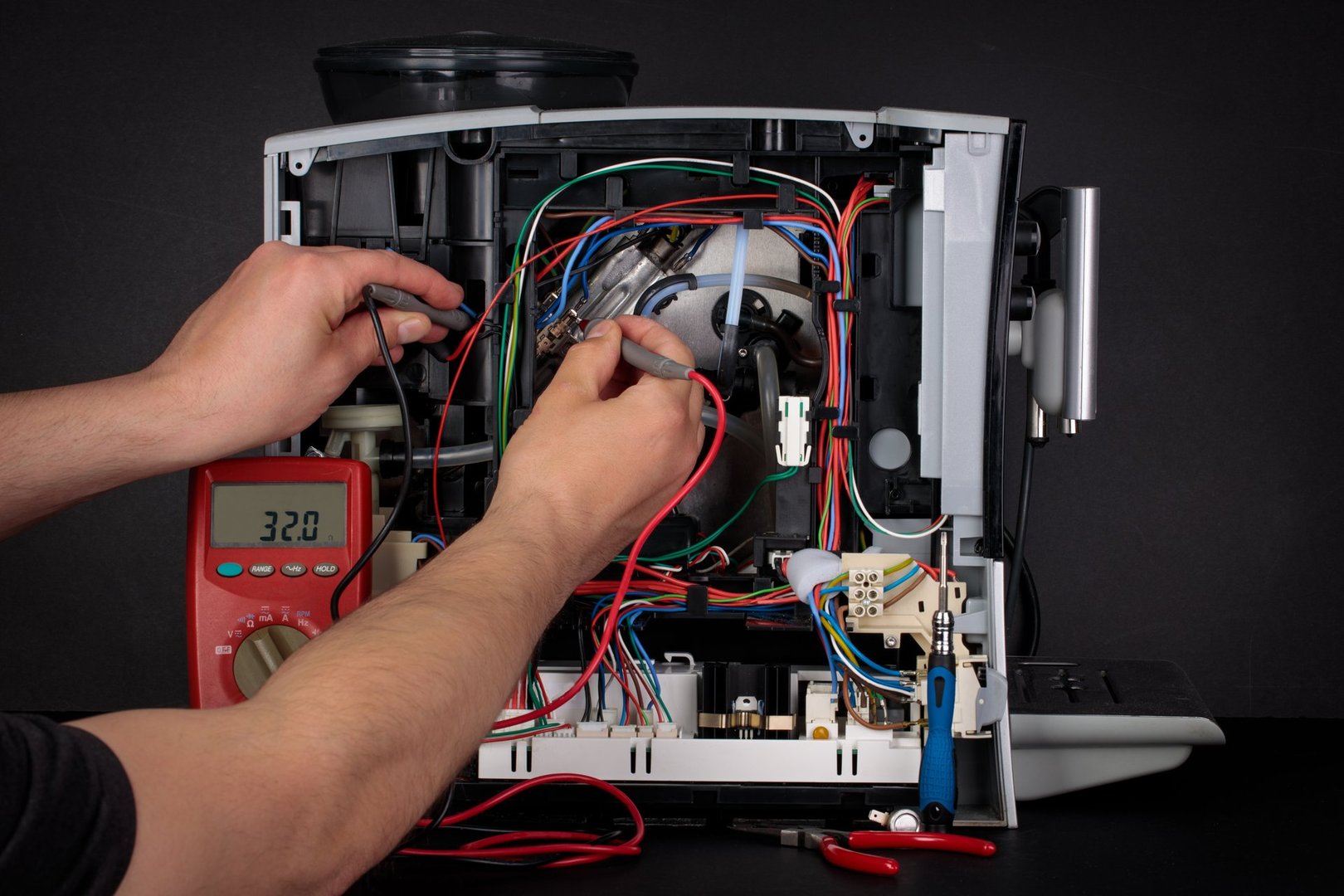 Coffee machine interior, service technician and tools