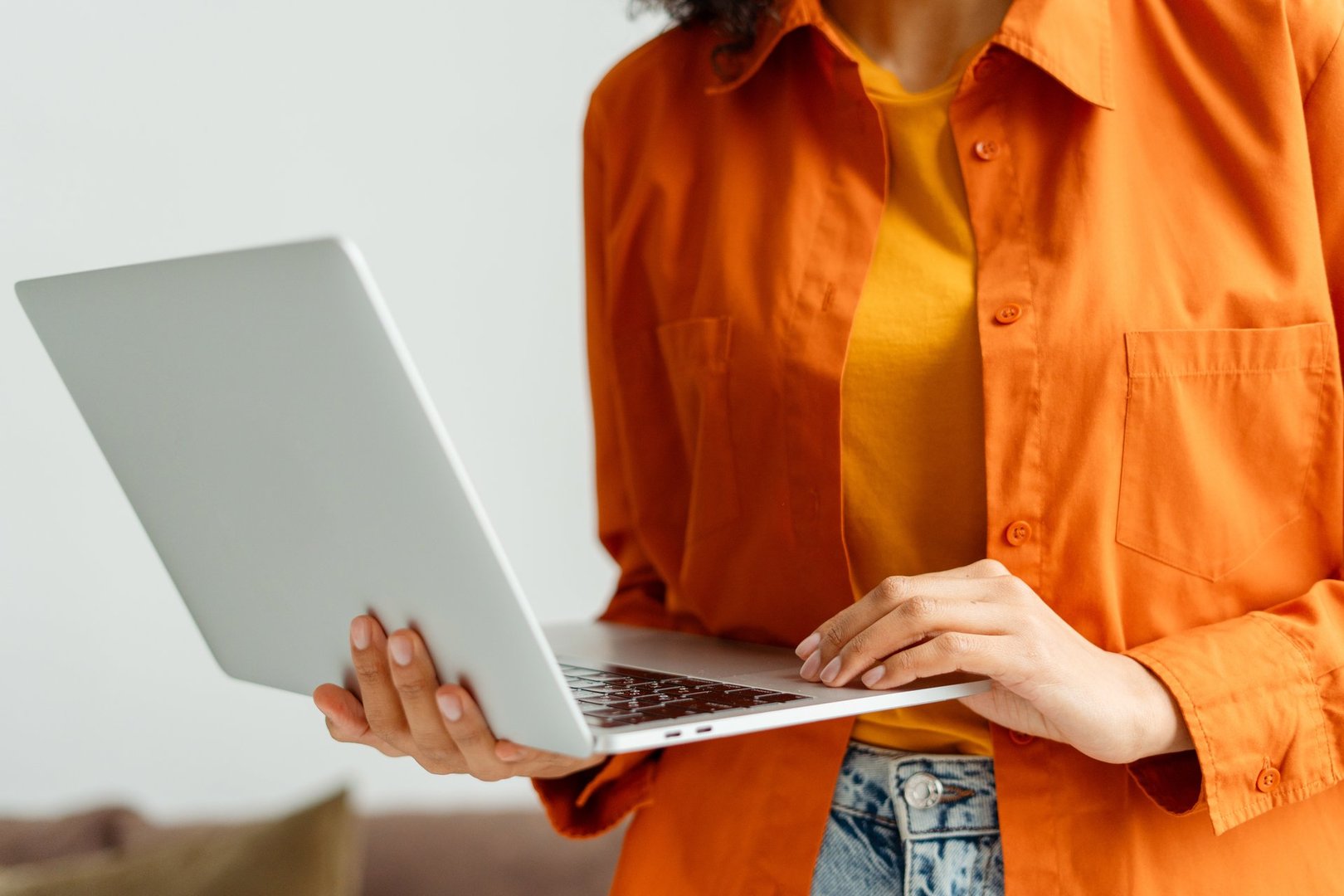 Business woman, freelancer, manager holding laptop computer working project in modern office. Cropped image of student studying, online education concept. Technology, successful business, career