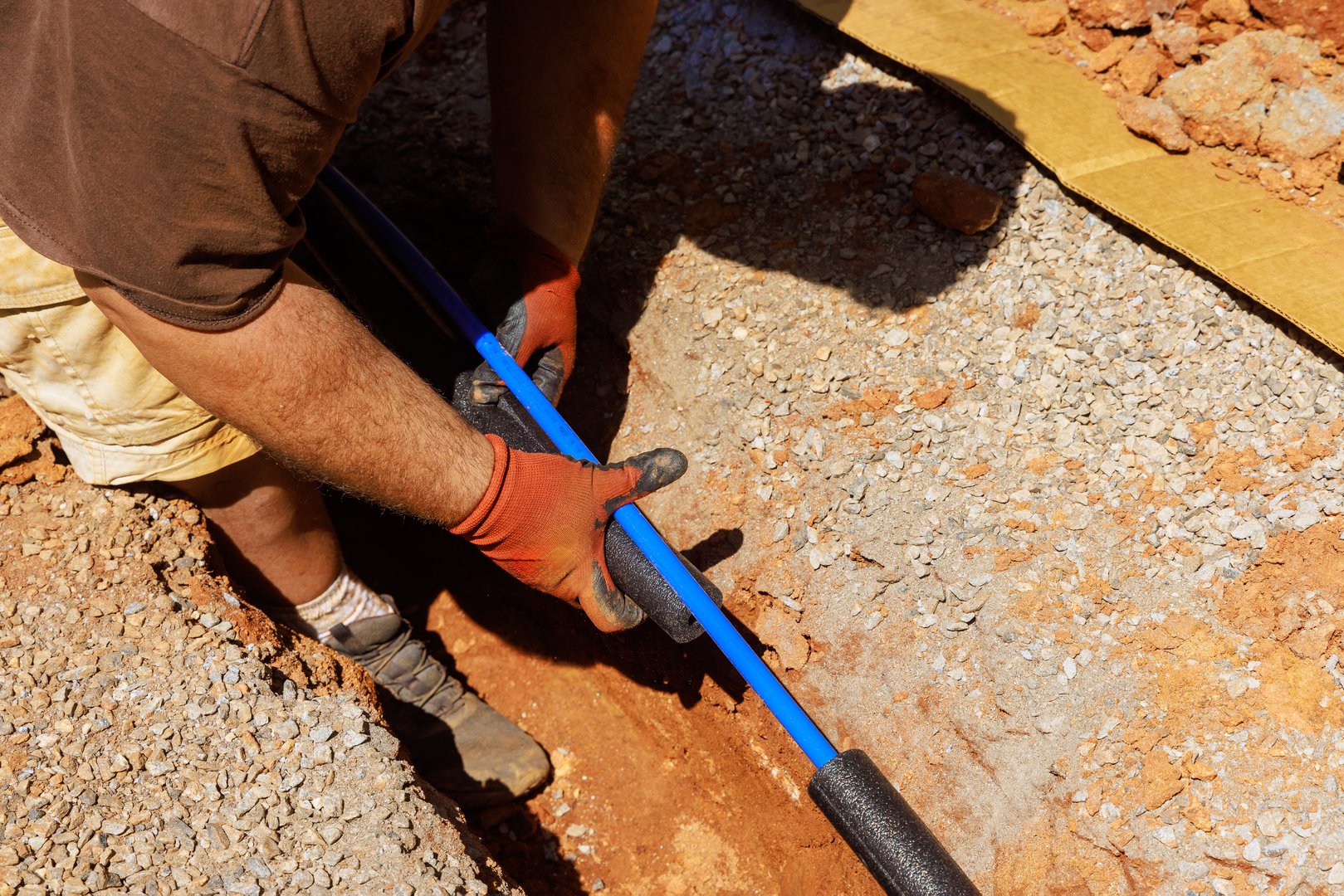 Plumber applied thermal insulation isolation to water pipe before installing it