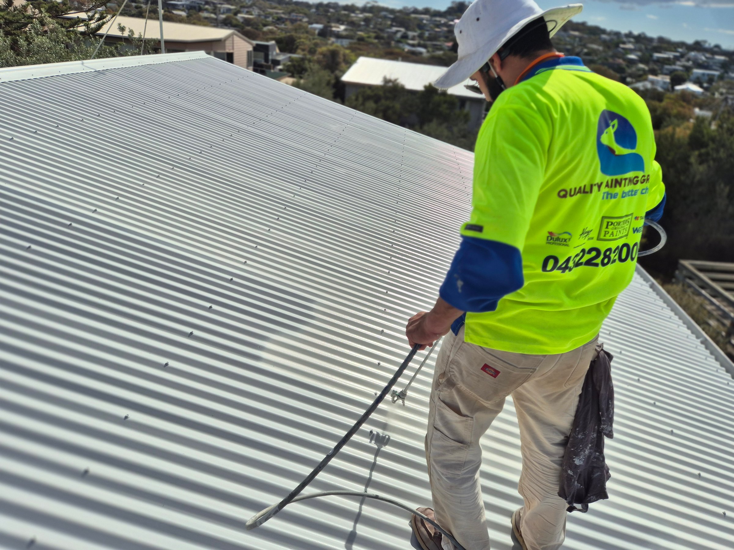 Quality Painting Group metal roof restoration project from April 2025 showing professional roof coating work