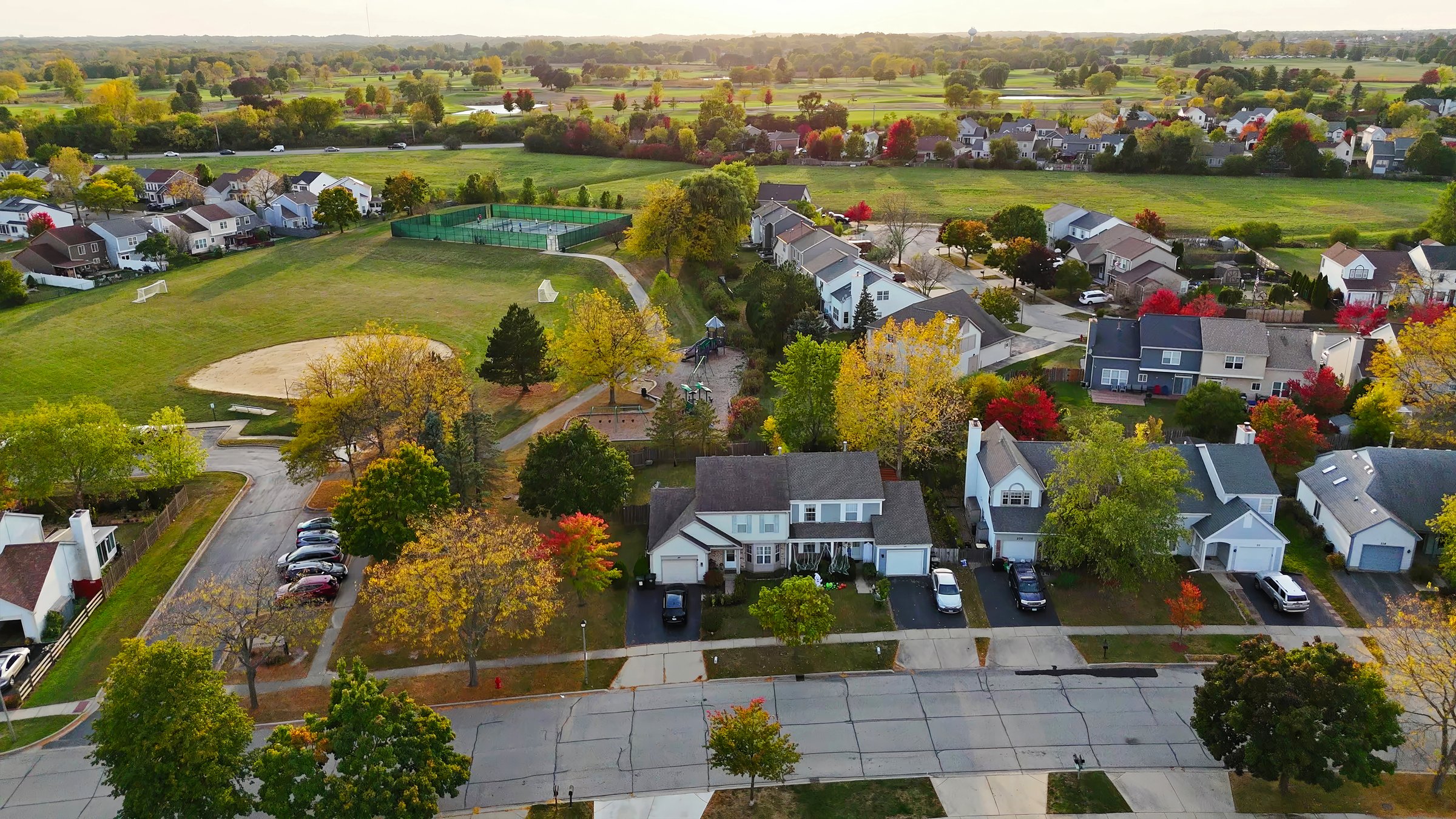 Aerial view of suburban neighborhood in Chicago, Illinois, with park and autumn colors, scenic homes
