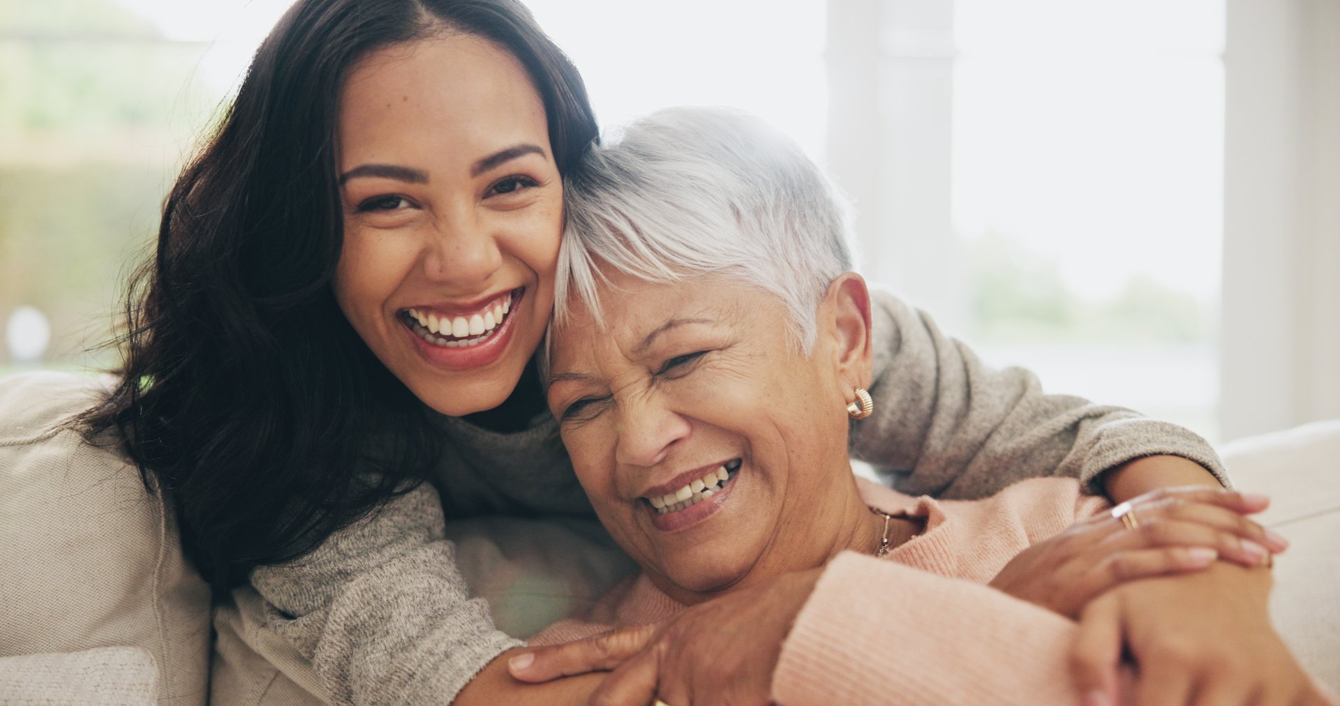 Mother and daughter smiling together